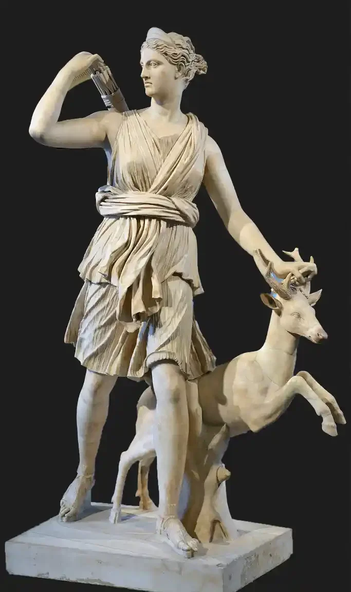 A tall marble statue of a young woman in a short belted tunic in mid-stride, reaching back over her shoulder to draw an arrow, a slender hunting dog leaping forward at her leg.