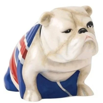 Ceramic figurine of a bulldog draped in a Union Jack flag, known as “Jack the Bulldog,” famously featured in James Bond films as a symbol of British resilience.