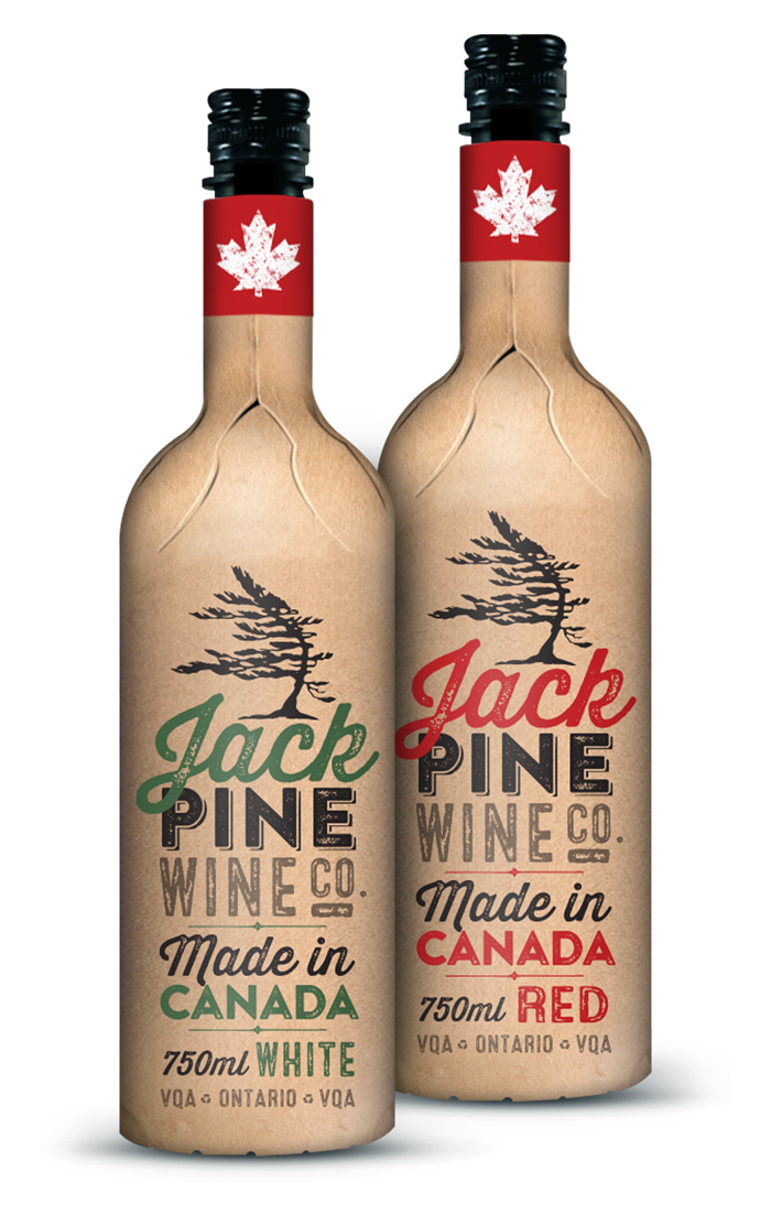 Two bottles of Jack Pine Wine, one labeled white and the other red, wrapped in paper with a Canadian maple leaf design on the necks.