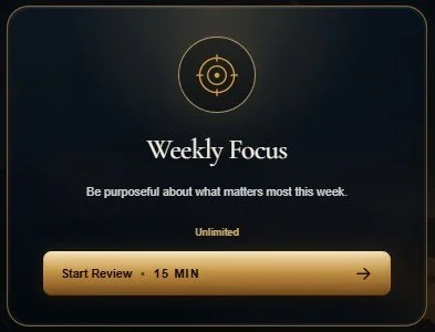 Digital app interface titled 'Weekly Focus' with a 'Start Review' button labeled '15 MIN' and a subtitle 'Be purposeful about what matters most this week'.
