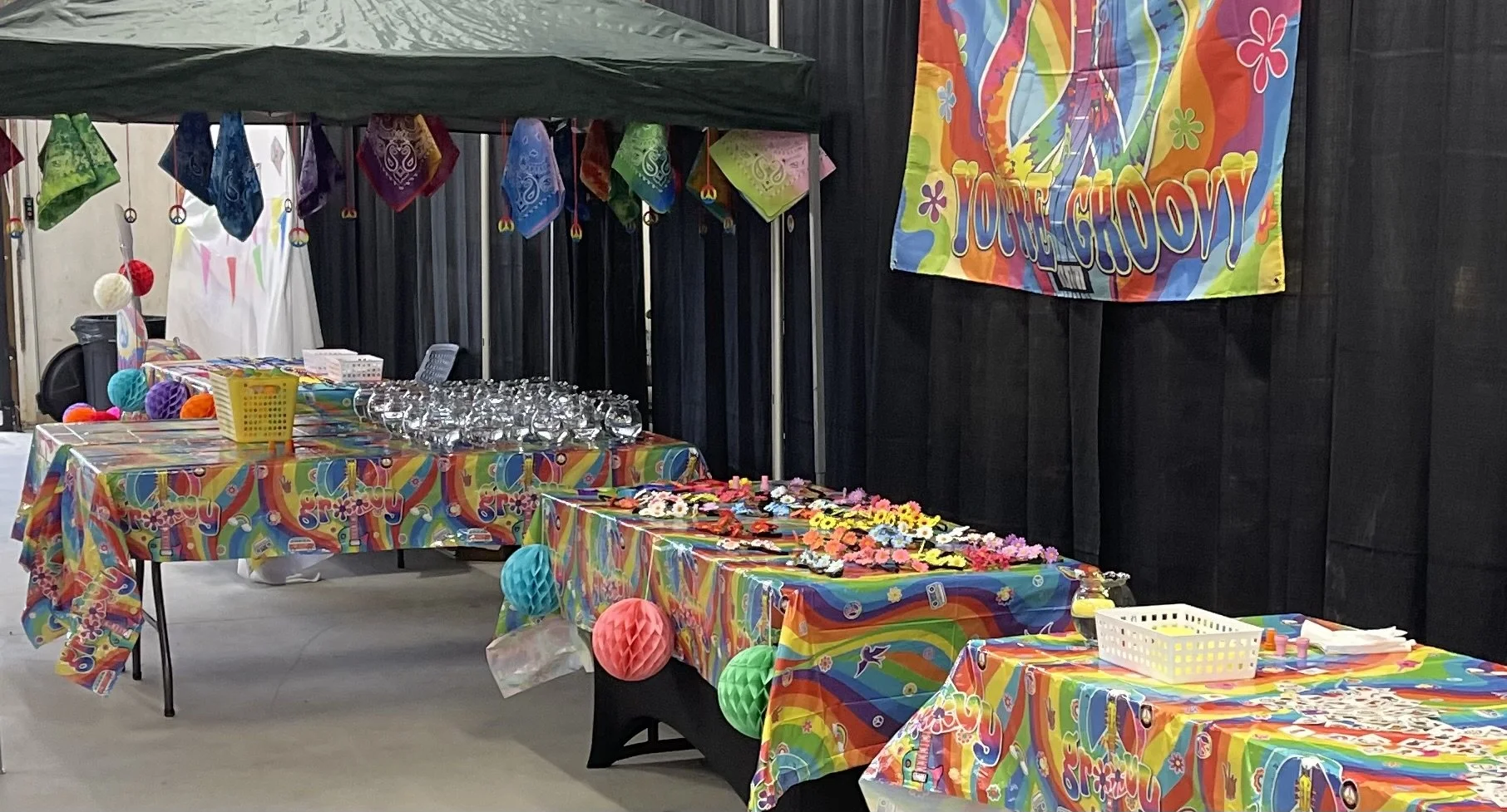 A hippy-themed party complete with bright colors, tablescapes, and coordinating bright decor; styled by Laura at Design & Gather.