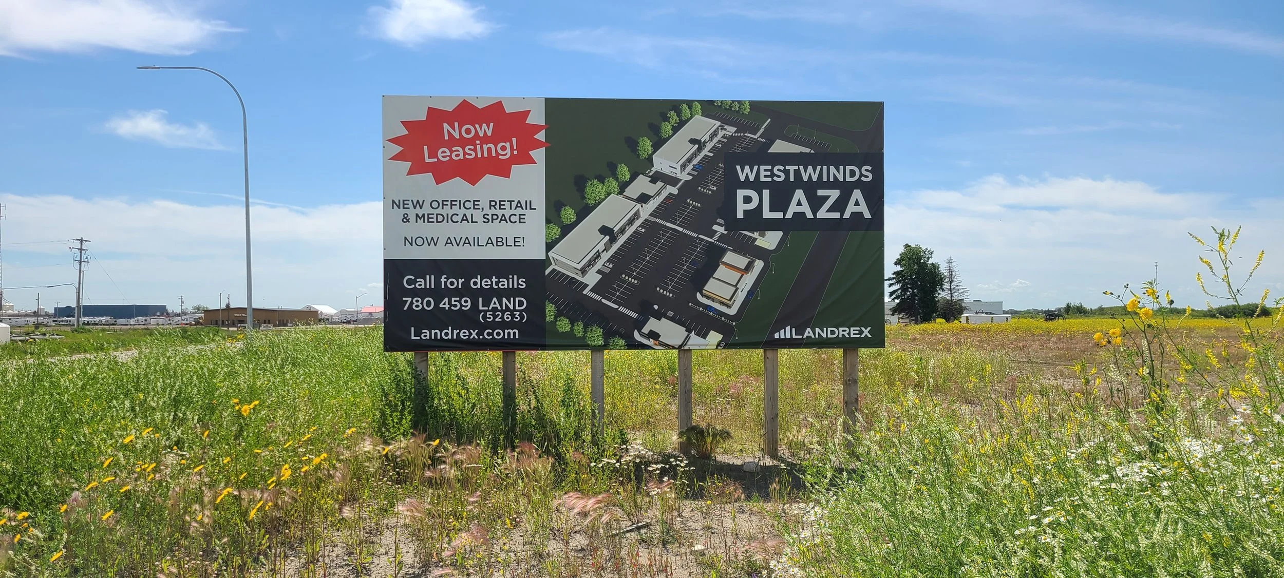 Sign advertising Westwinds Plaza with a site plan, details about leasing new office, retail, and medical space, and contact information.