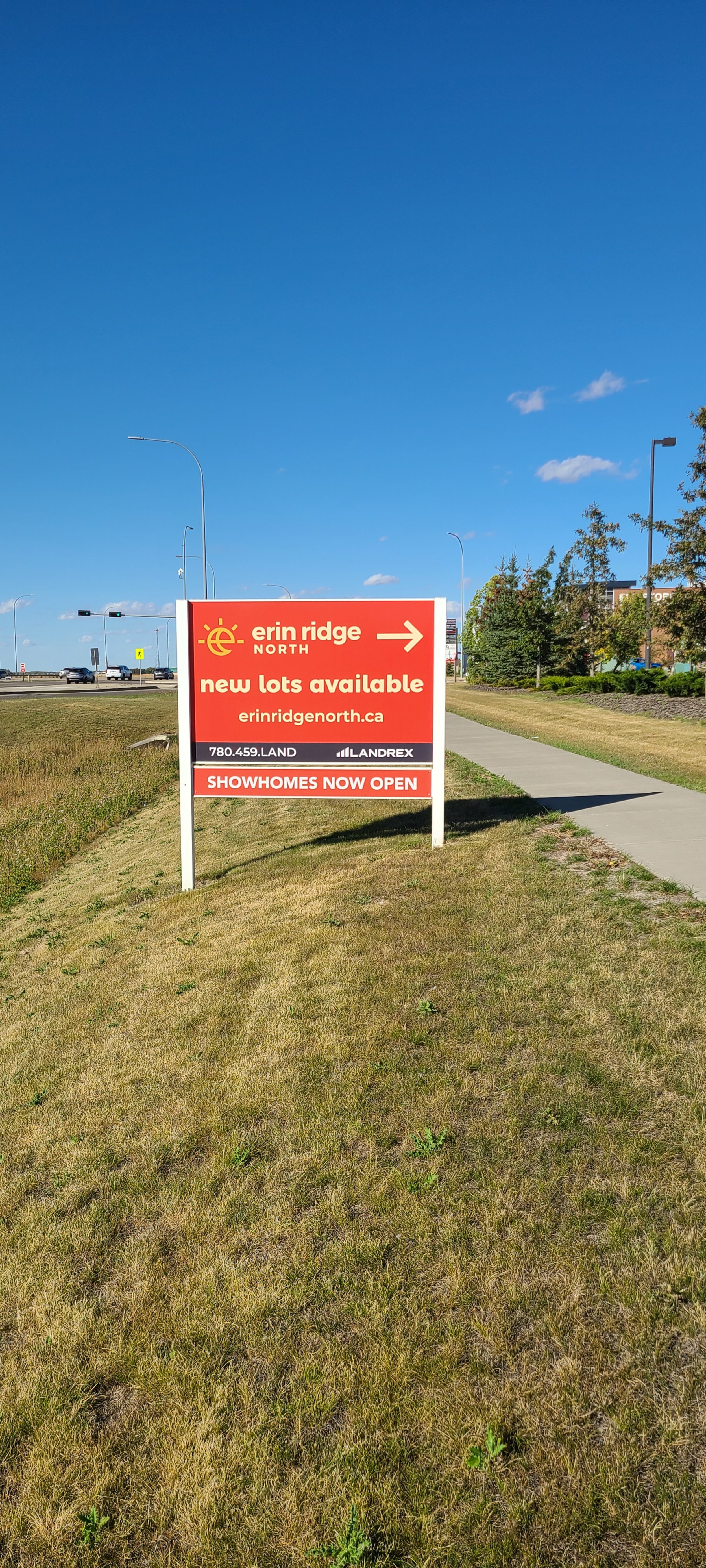 Red and white sign advertising Erin Ridge North real estate development.