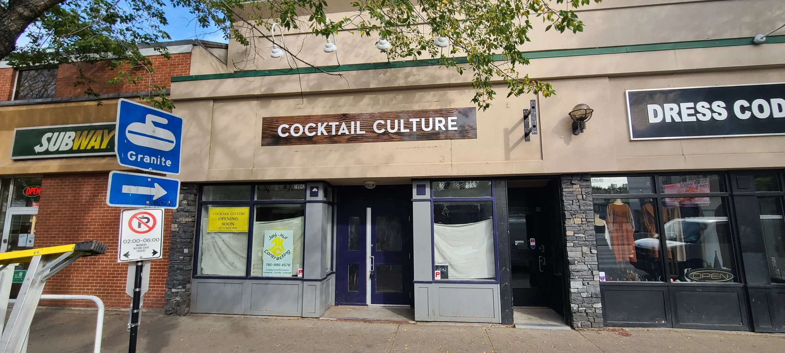 Storefront with signs for Cocktail Culture