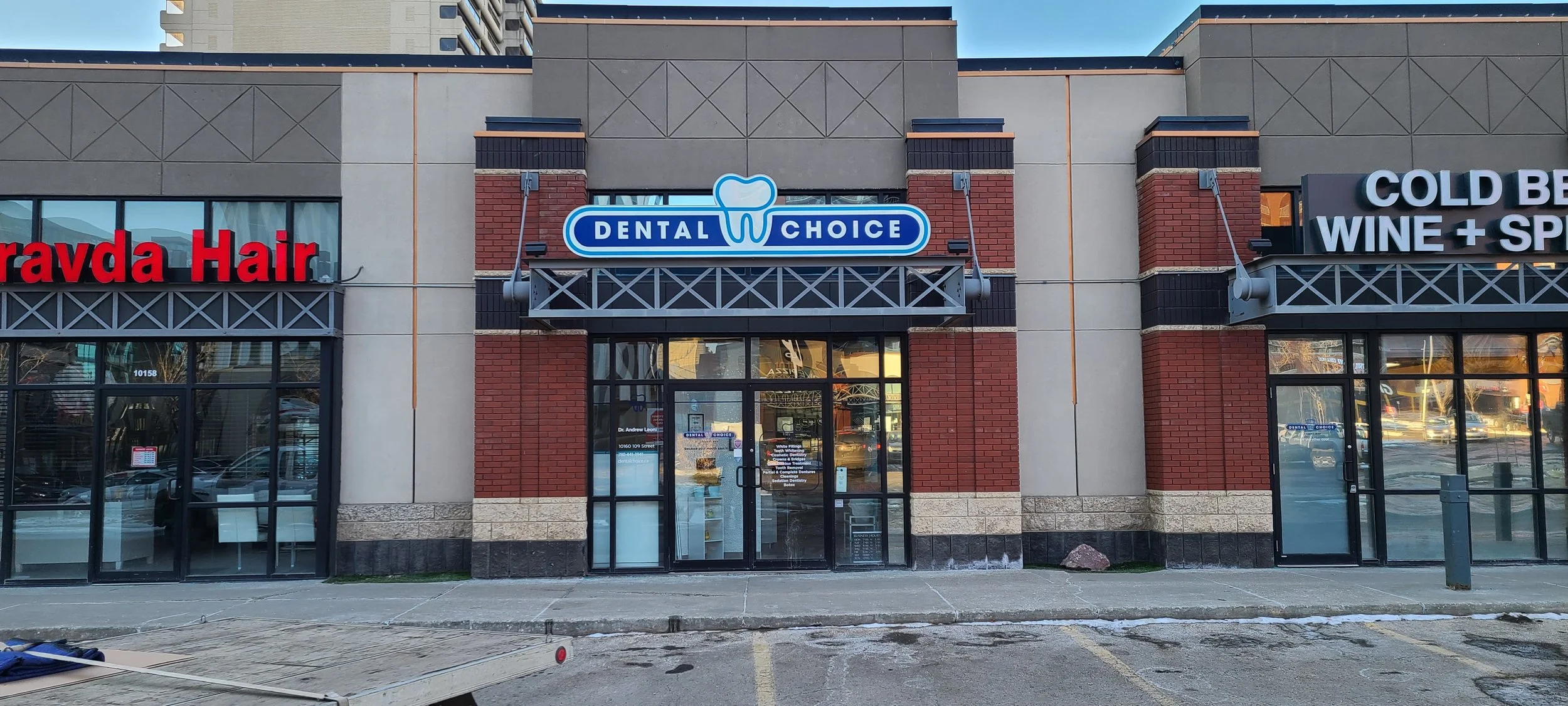 Storefront with signs for a dental office.