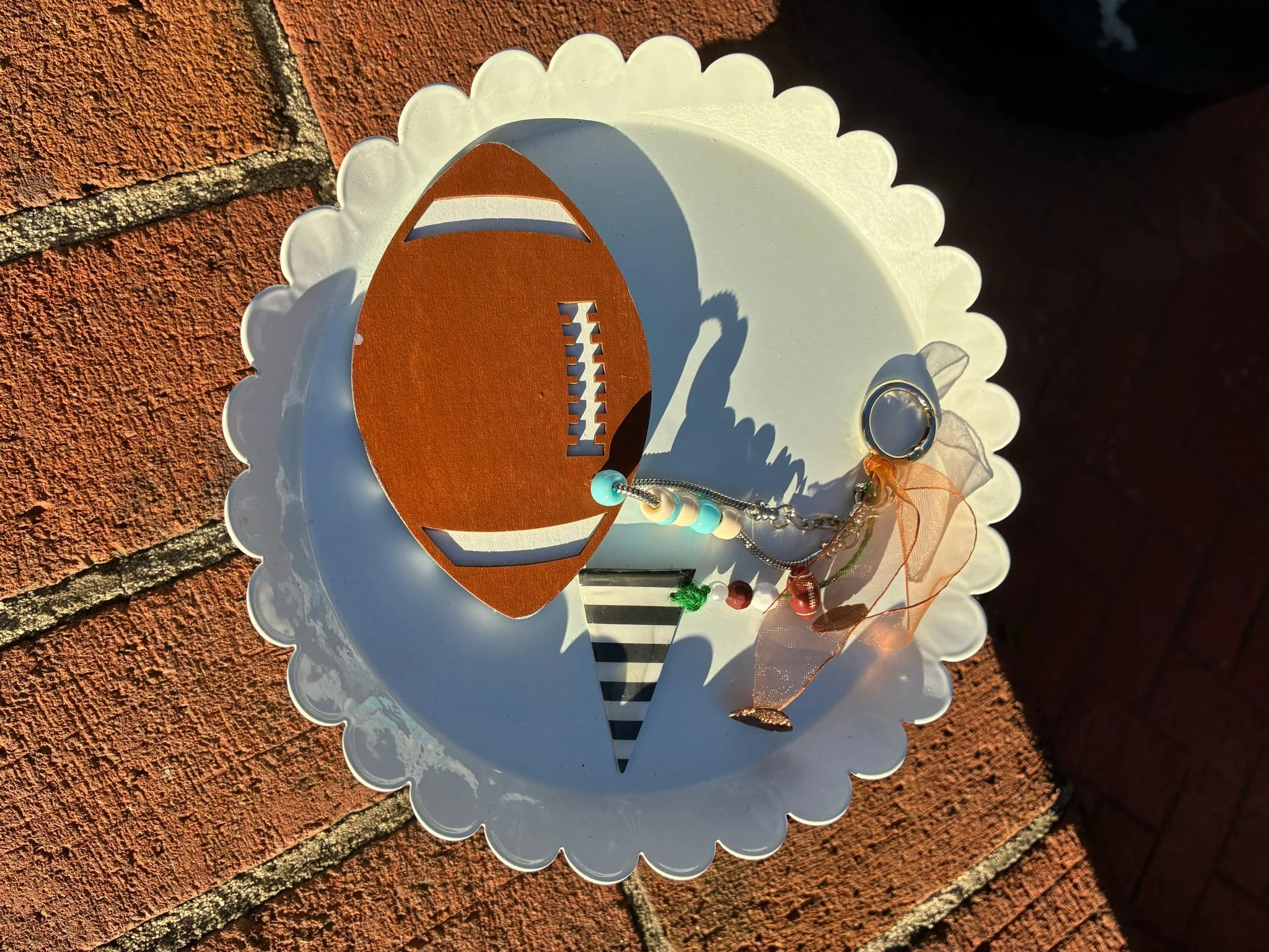 ROW 39  GO HEELS FOOTBALL BACKPACK CHARM.JPEG