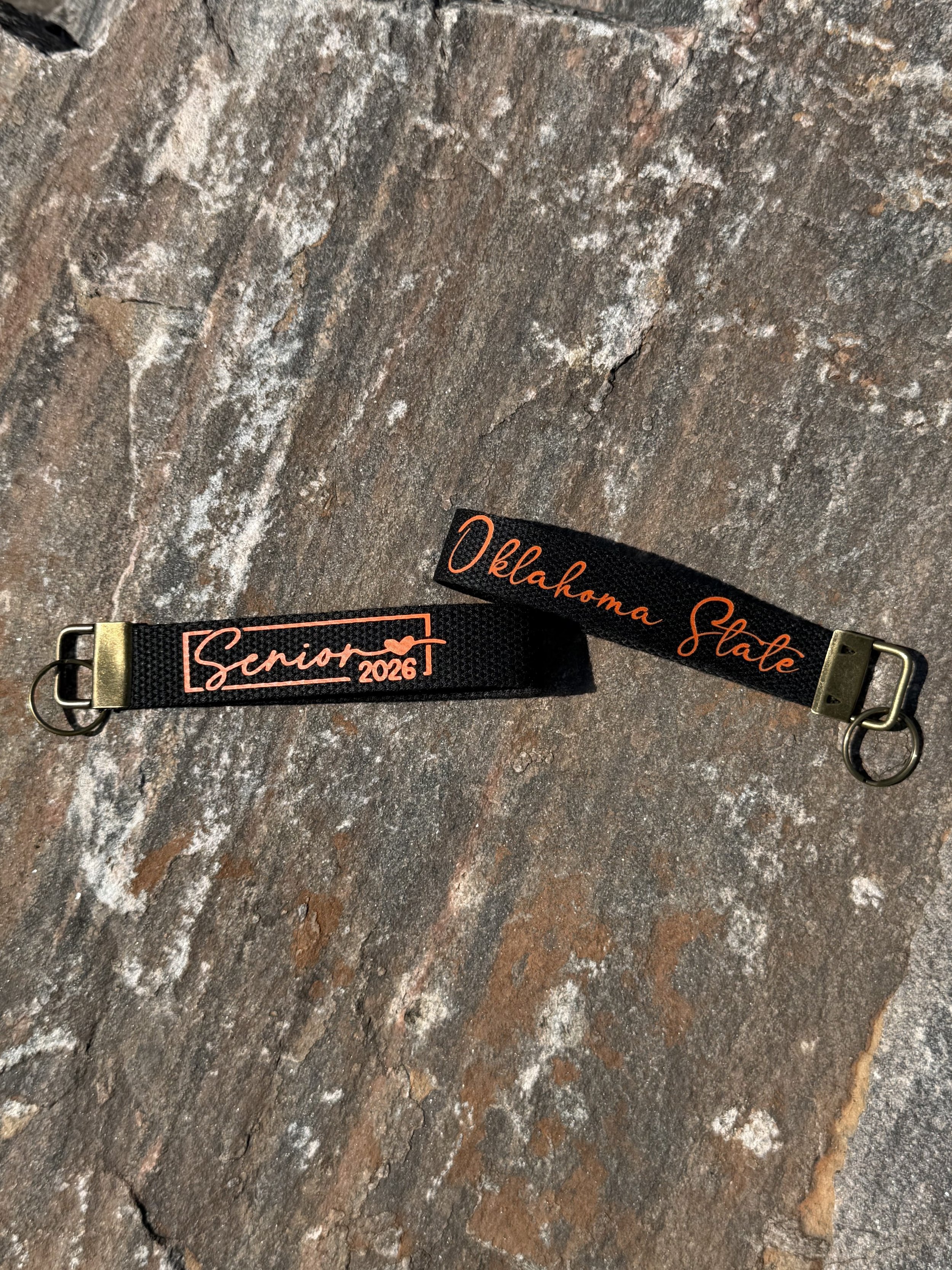 Senior_2026_Wristlet_Rock_Mockup_Black.jpg