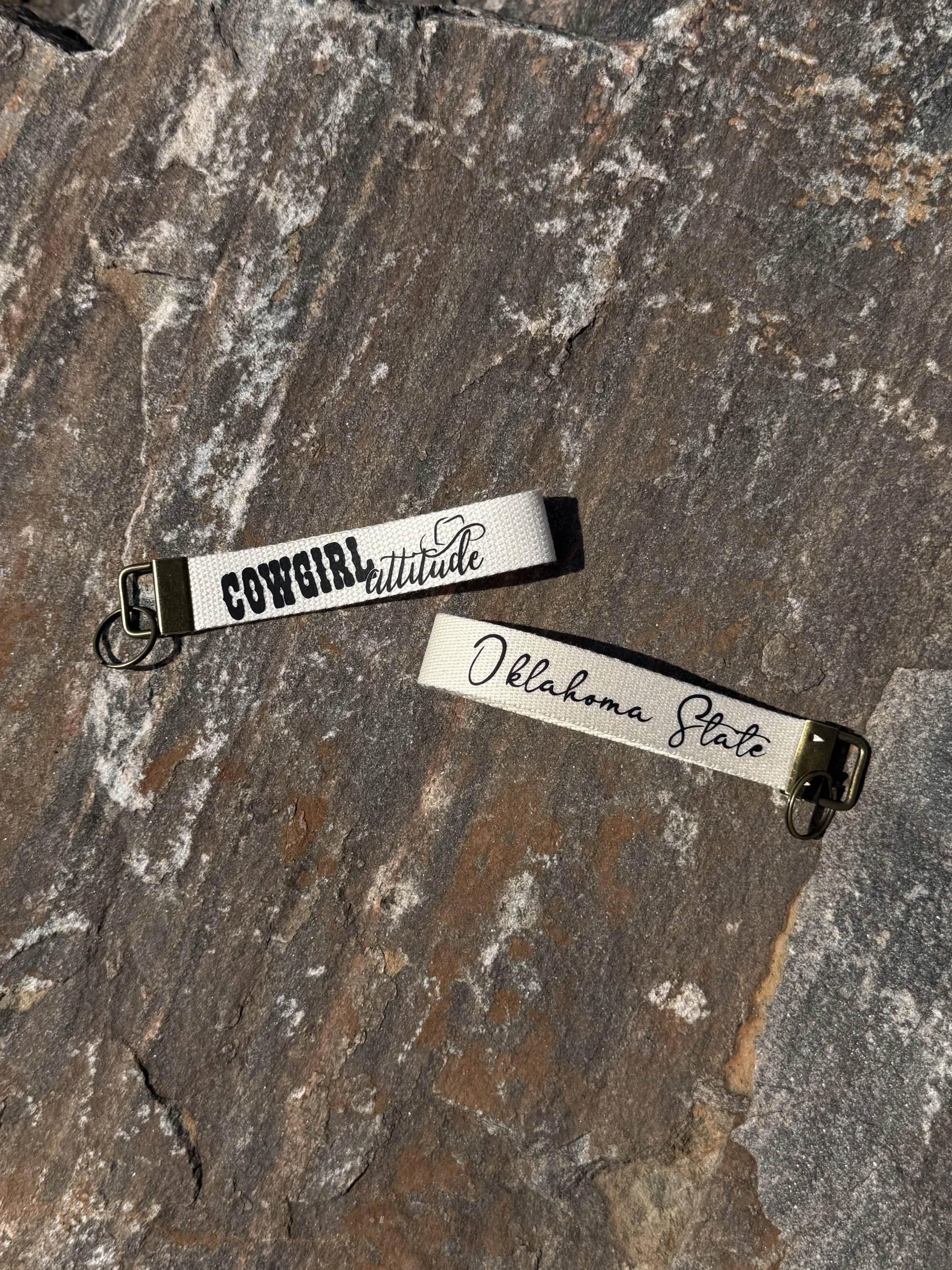 Cowgirl_Attitude_Wristlet_Rock_Mockup_Cream.jpg