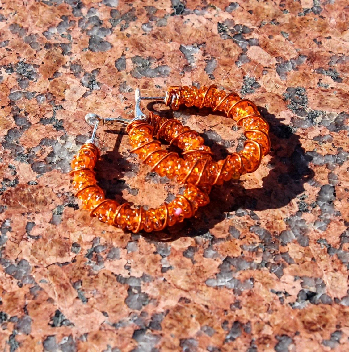 _orange bright_ beaded hoops.jpg