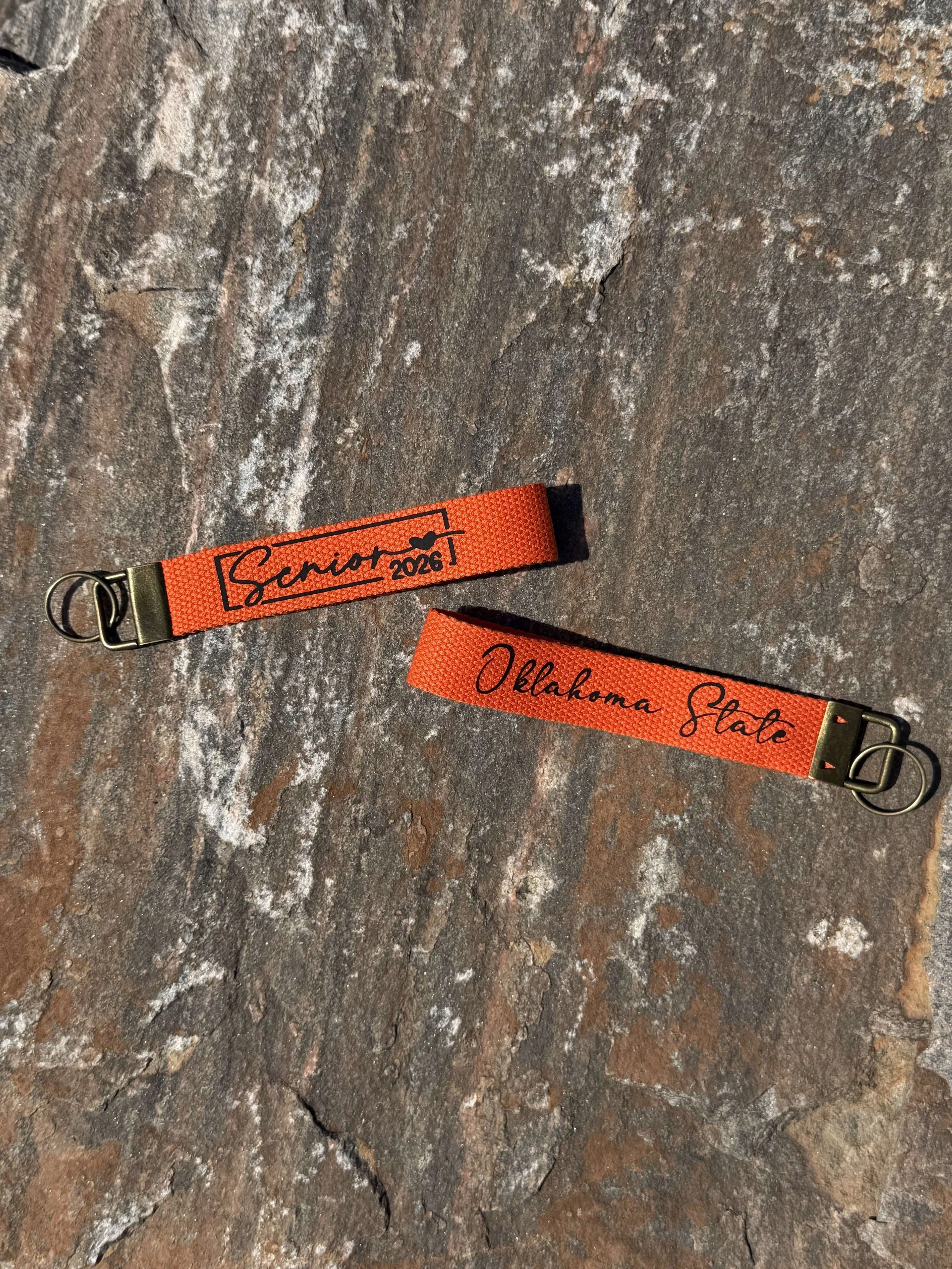 Senior_2026_Wristlet_Rock_Mockup_Orange.jpg
