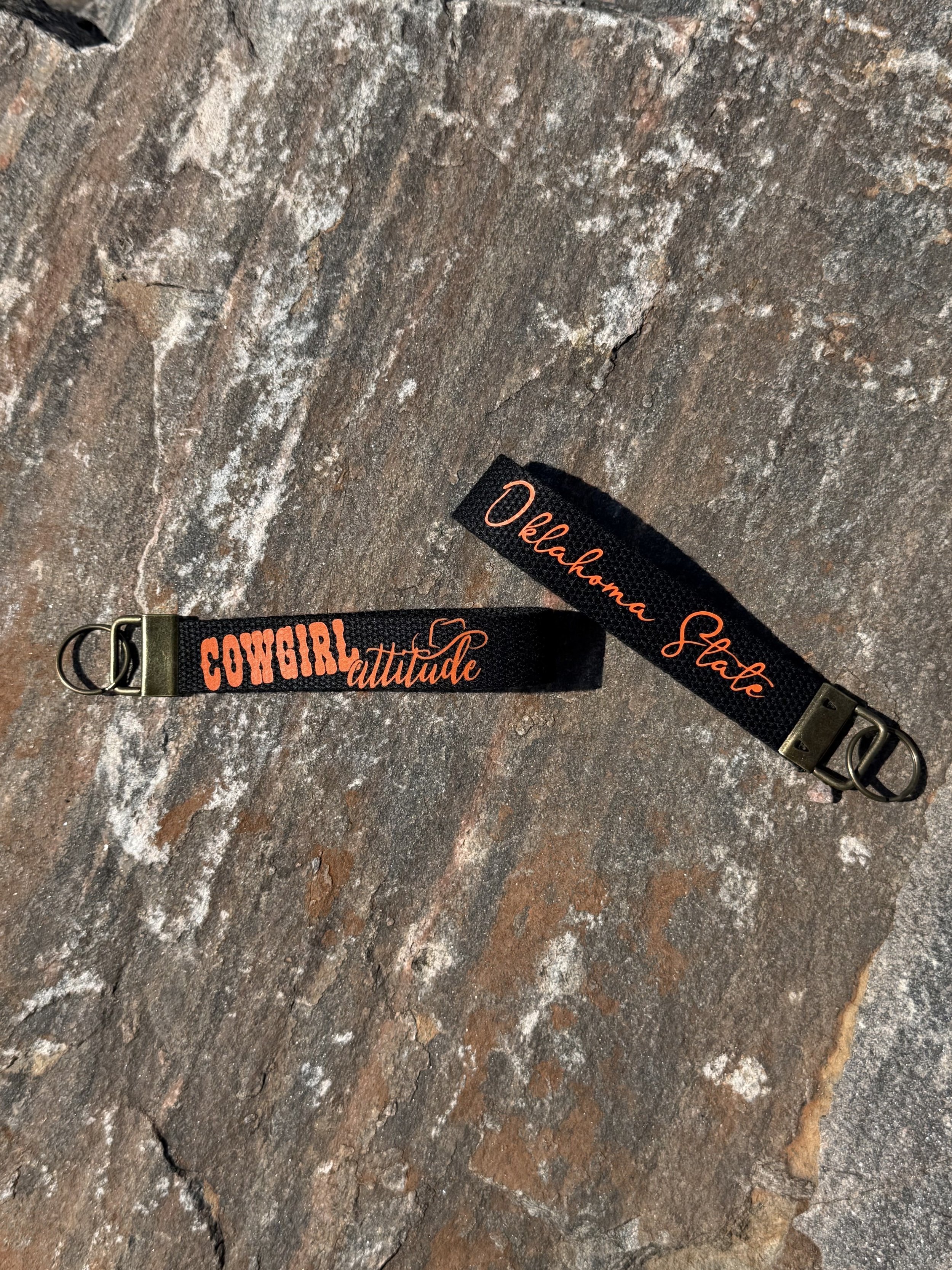 Cowgirl_Attitude_Wristlet_Rock_Mockup_Black.jpg