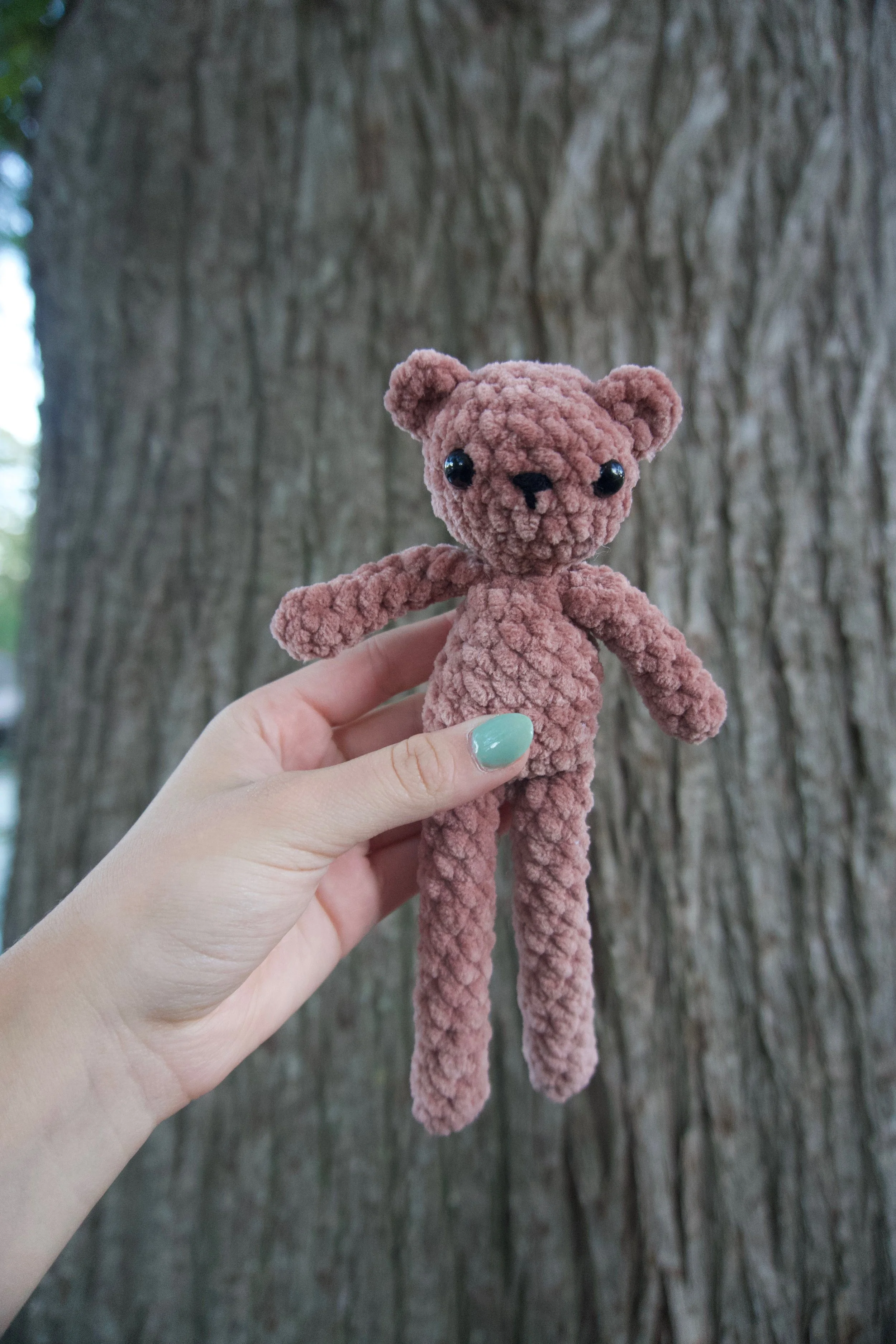 ted the teddy bear plushie held up.jpeg