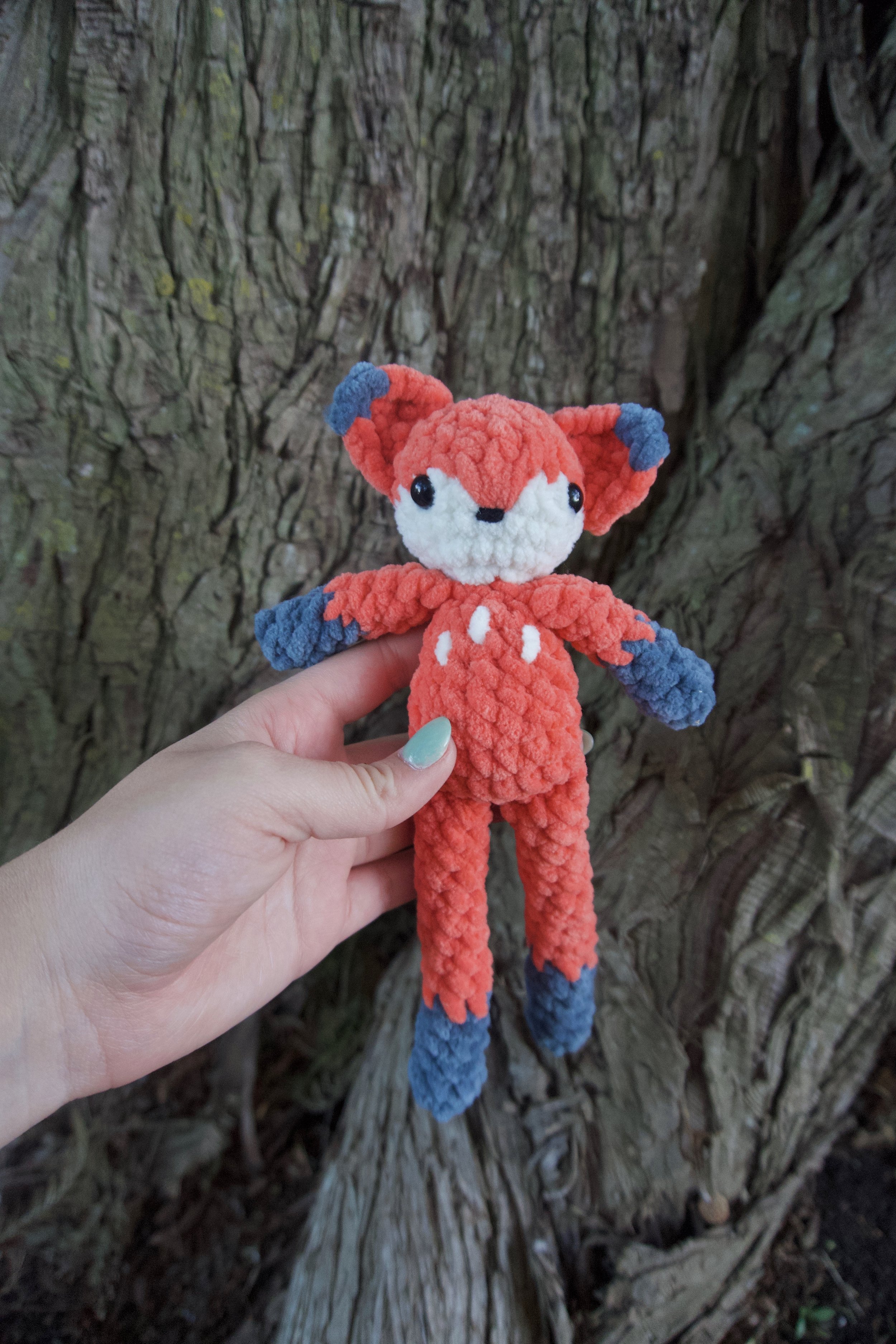 fox held in front of tree.jpeg