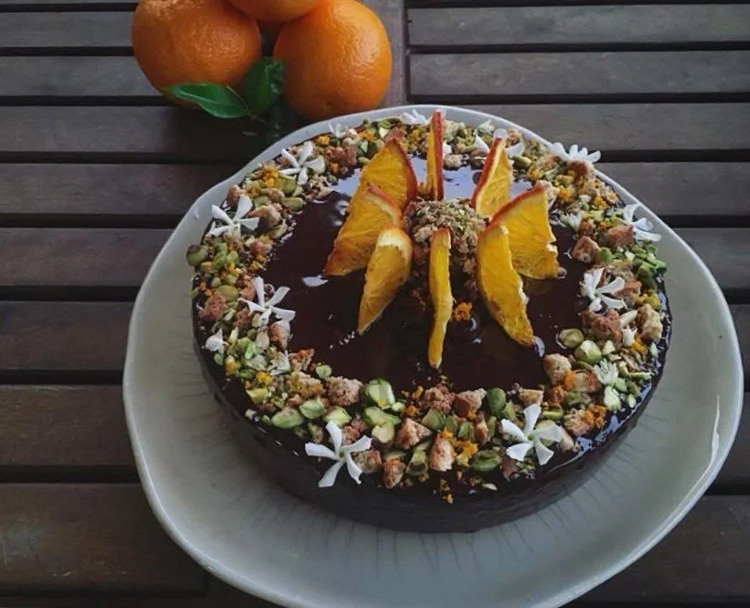 Pistachio-orange biscotti themed cake with chocolate ganache and dehydrated oranges. 🍊 

End a beautiful Italian cuisine dinner with a punch of what Florida has for generations been known for! Book your romantic dinner for two or the whole group tod