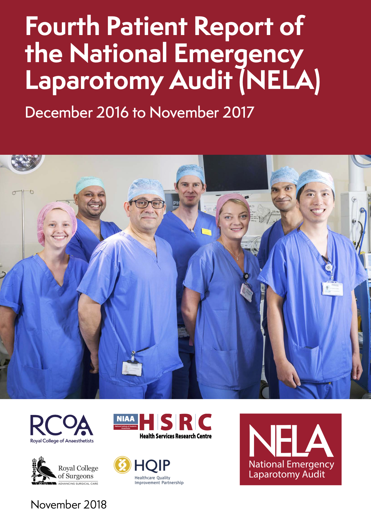 Group of medical professionals in scrubs and surgical caps smiling in hospital operating room.