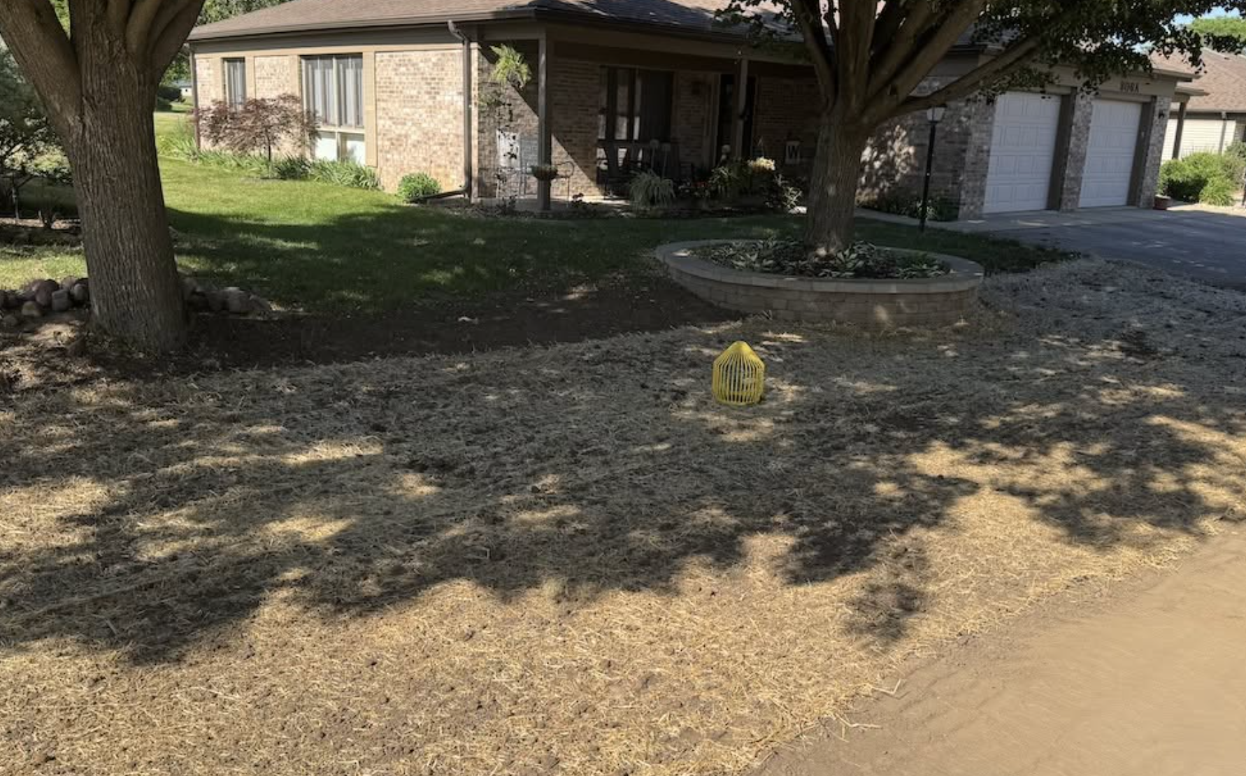 Residential yard prepared for drainage improvements and grading to eliminate standing water and improve water flow.