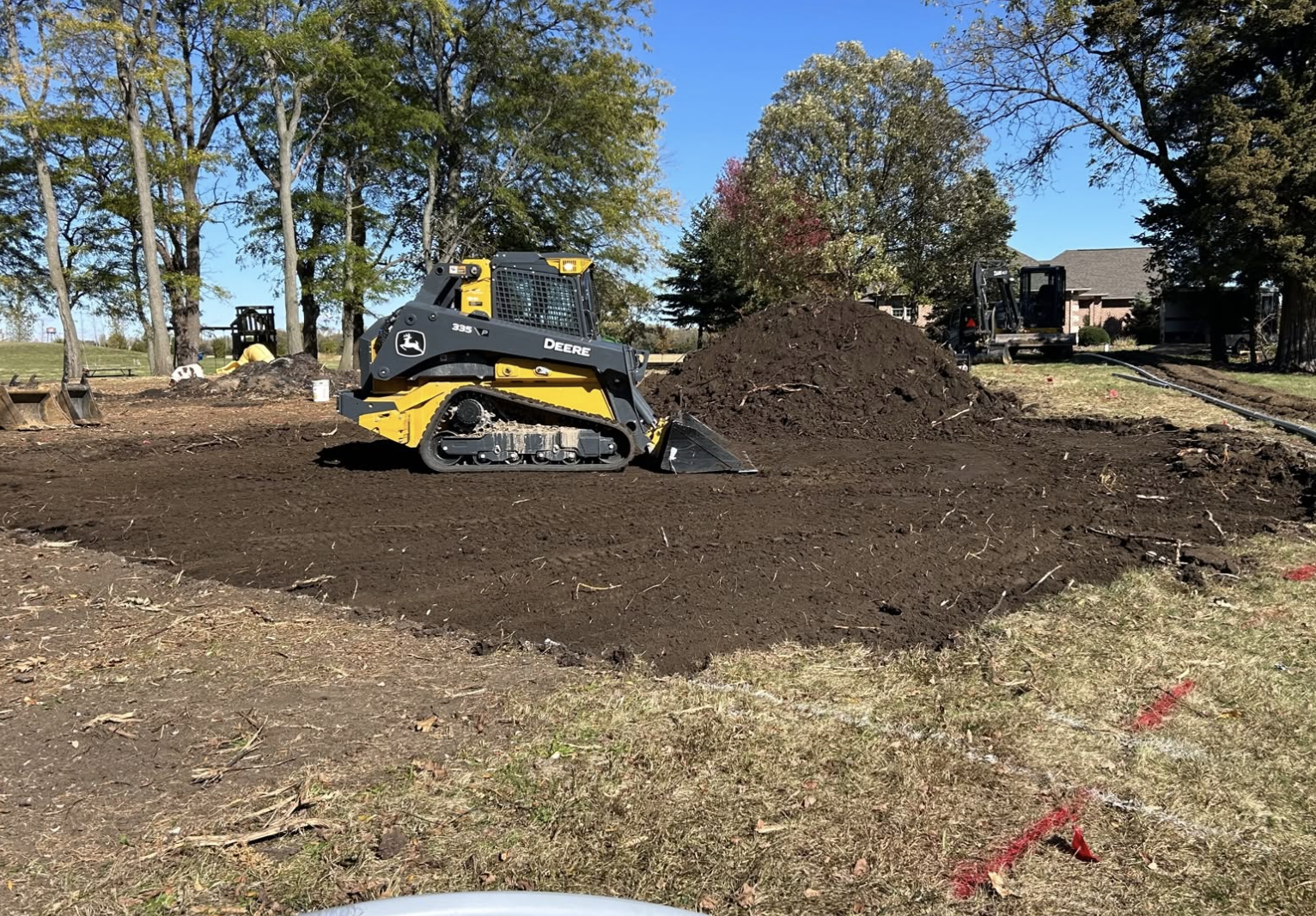 Forestry mulching services restoring overgrown property in Earlville, IL.
