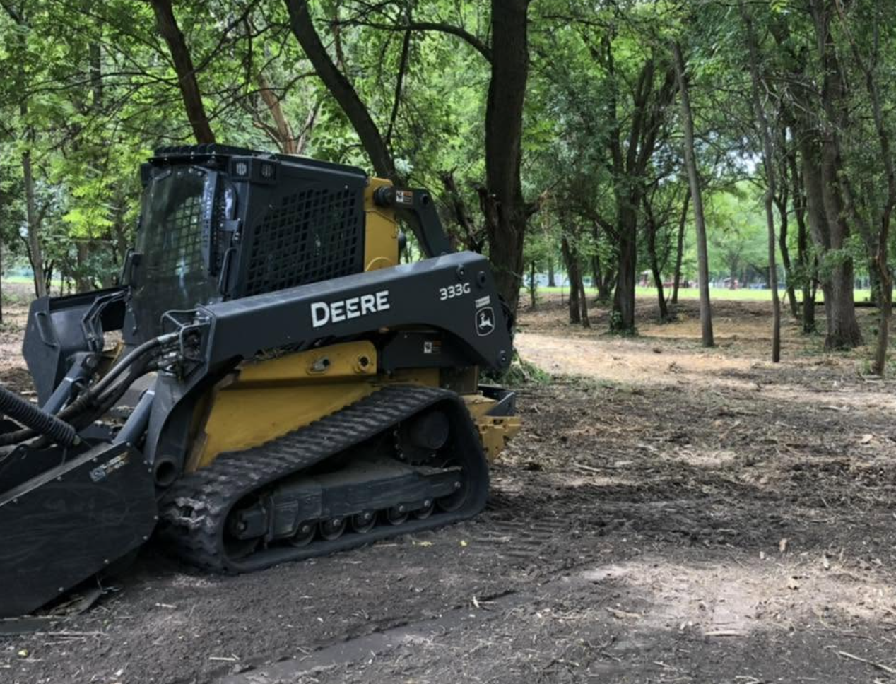 Professional forestry mulching services completed in Peru, IL to clear overgrown vegetation and improve property access.
