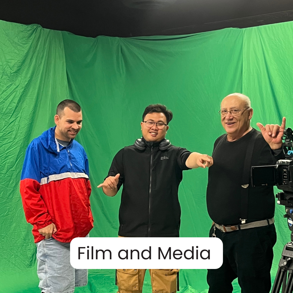 Three men standing in front of a green screen with film equipment nearby. The man in the middle is pointing forward, the man on the right is making a gesture with his hand, and the man on the left is smiling. The caption reads 'Film and Media'.