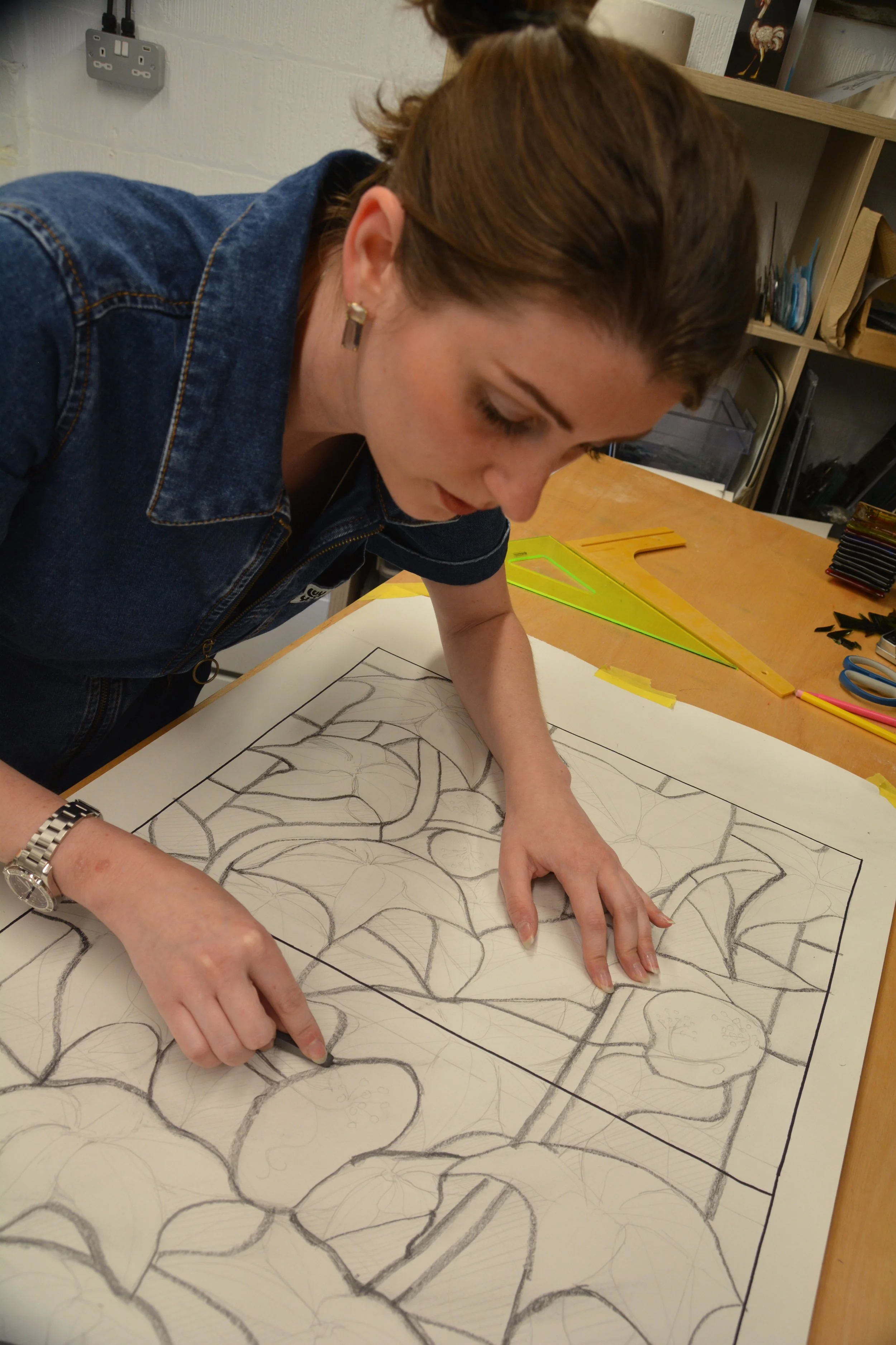 Drawing a design for a commissioned garden inspired window, 2025