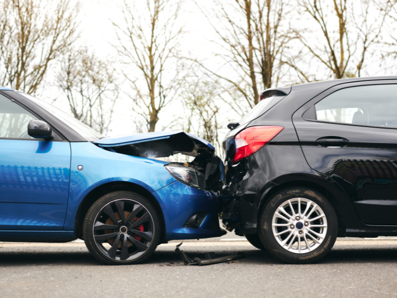 Two cars involved in a rear-end collision, highlighting the importance of sufficient auto liability insurance for California drivers.