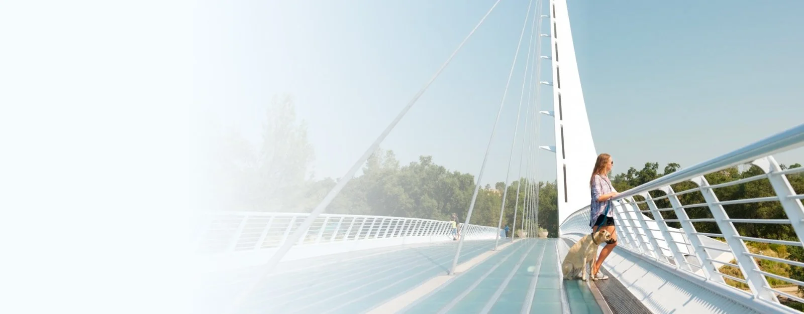 Woman on sundial bridge in Redding, CA covered with Farmers Insurance