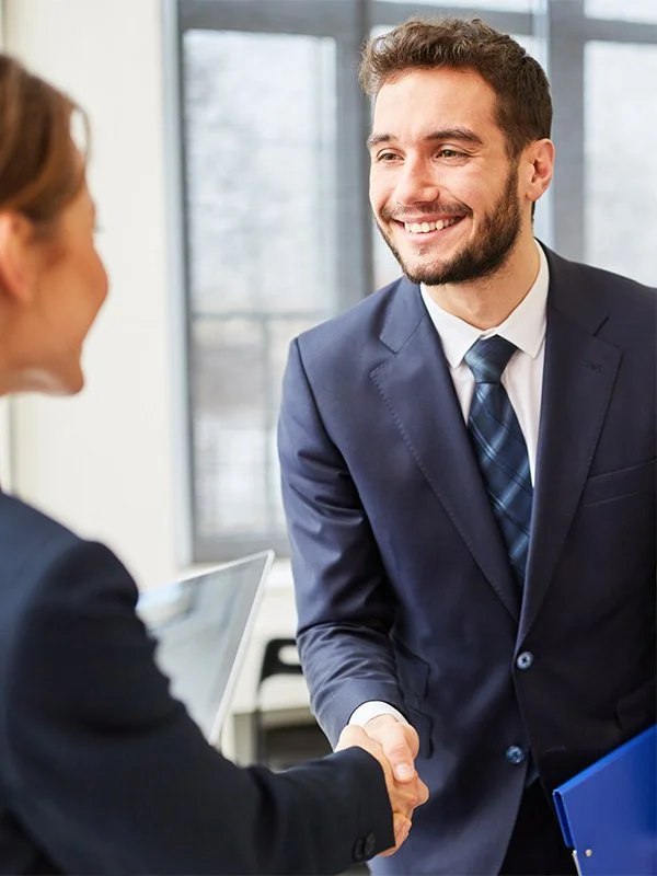 Insurance agent in Redding with business owner receiving business life insurance