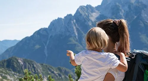 Mother and child on hike covered by index universal life insurance