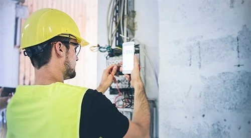 Electrician in Redding covered by workers comp business insurance