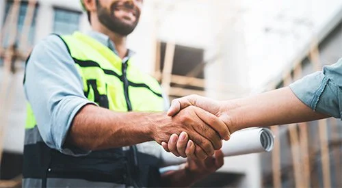 Two employees covered by OSHA compliance with business insurance