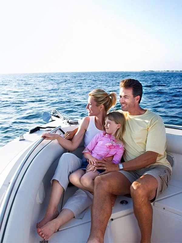 Family on boat covered by umbrella insurance in Redding, CA