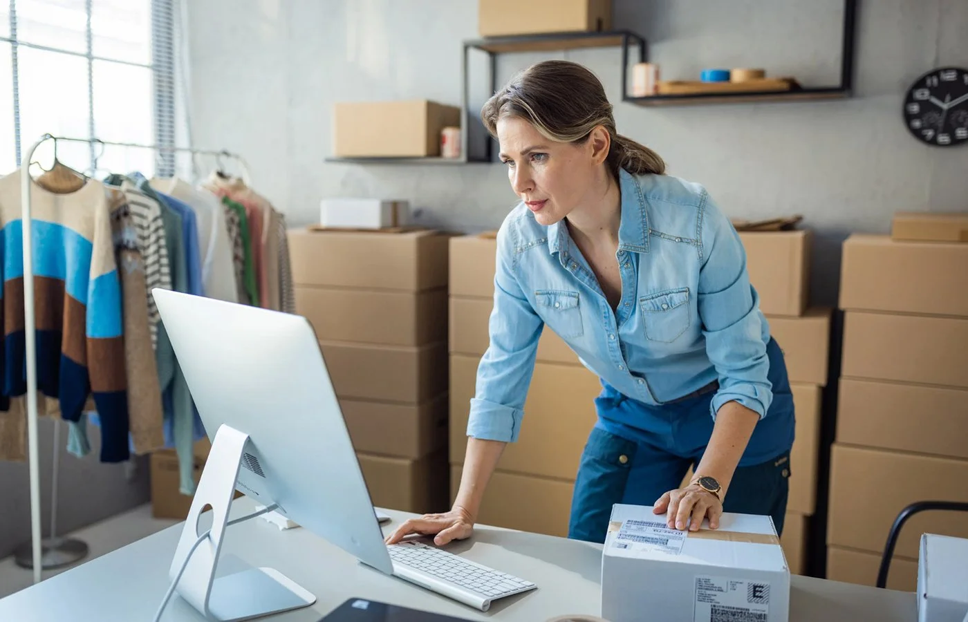 Business owner looking on computer for a Business Insurance Agent in Redding, CA