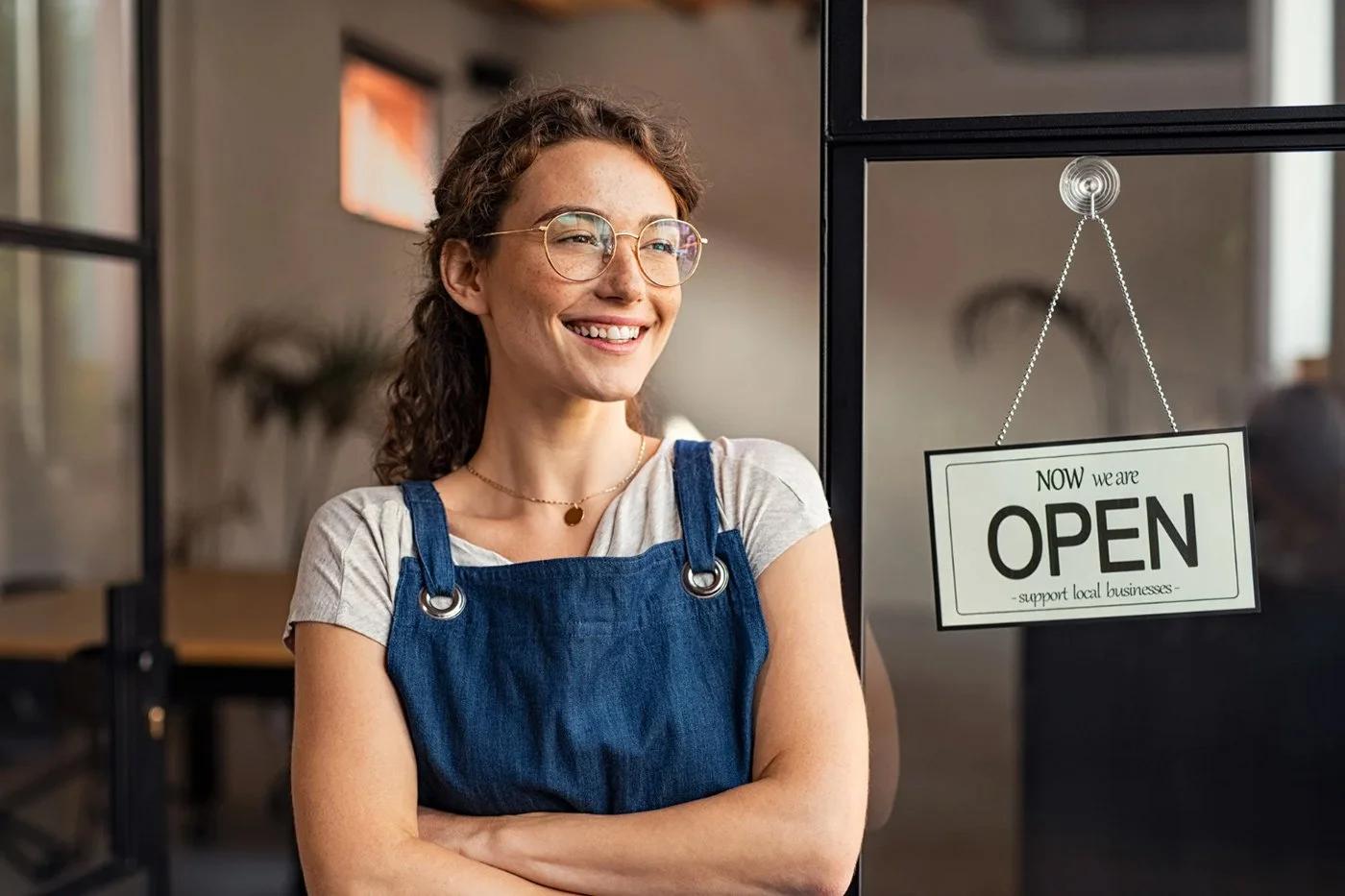 Employee smiling because she is covered with her bundled insurance discount program in Redding, California