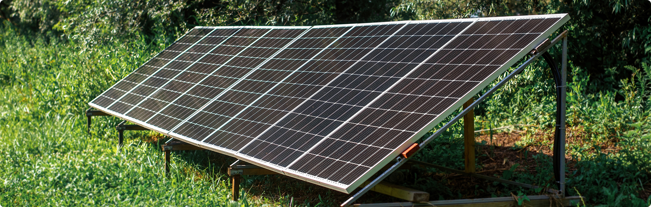 Solar panel installation on a grassy field.