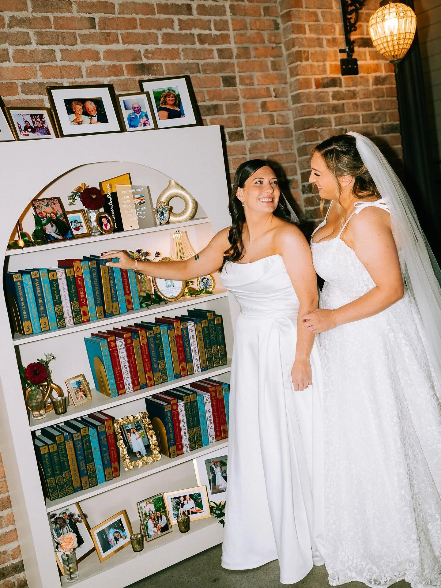 A love story for the books!🤍📚 Every detail of this wedding was crafted with intention. From the handmade book shelf filled with personalized &ldquo;books&rdquo; for every guest, to the custom back drop and cake plates painted by the brides themselv