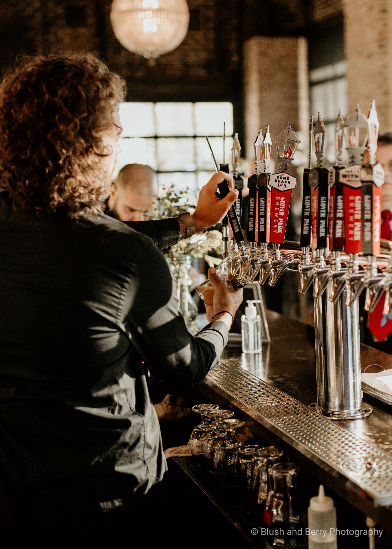 Man pouring a beer from the Lamp Lounge Bar
