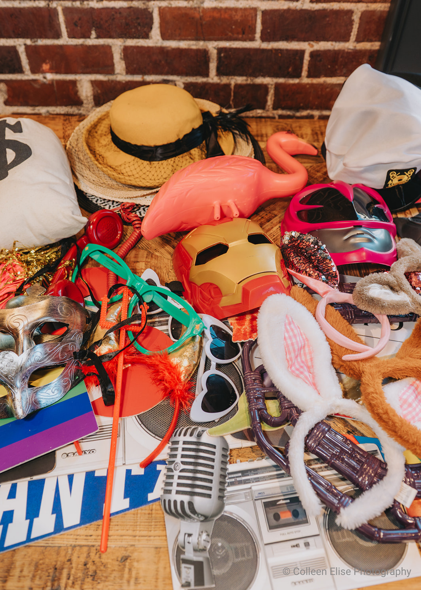 table full of various party costume supplies for photo booth use