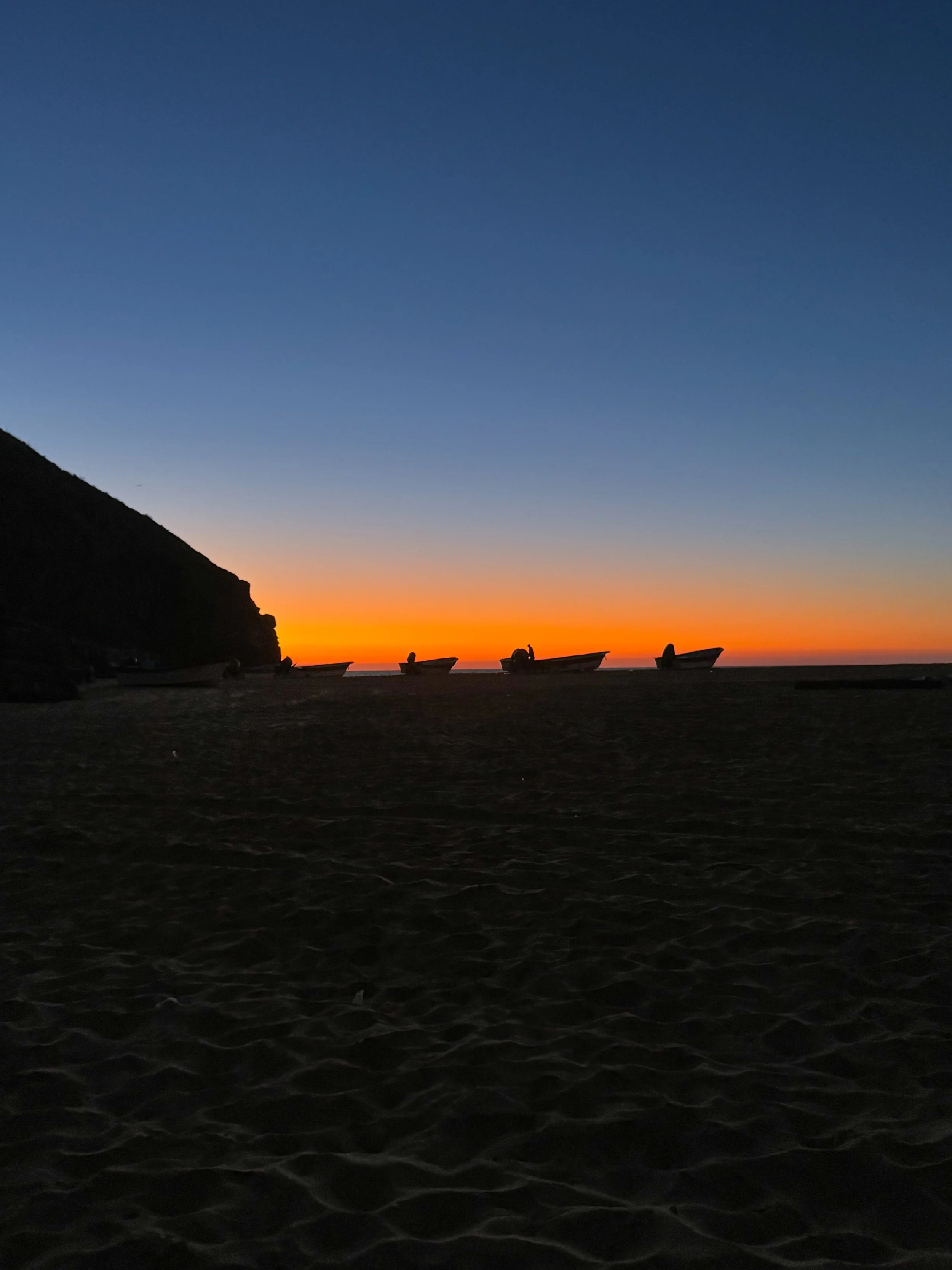 boats at sunset at Cerro Punta Lobos