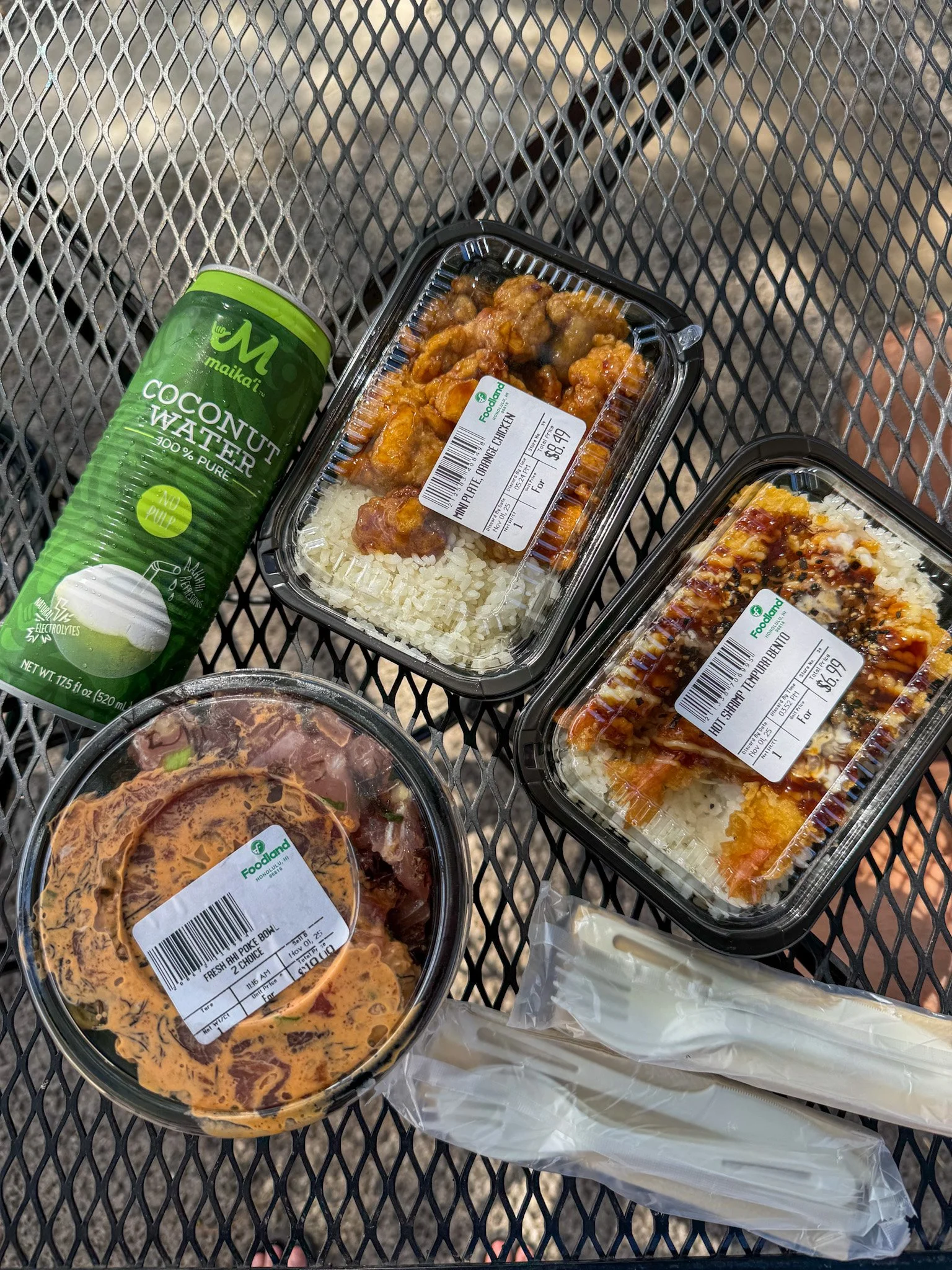 selection of prepared foods, poke and coconut water from foodland farms