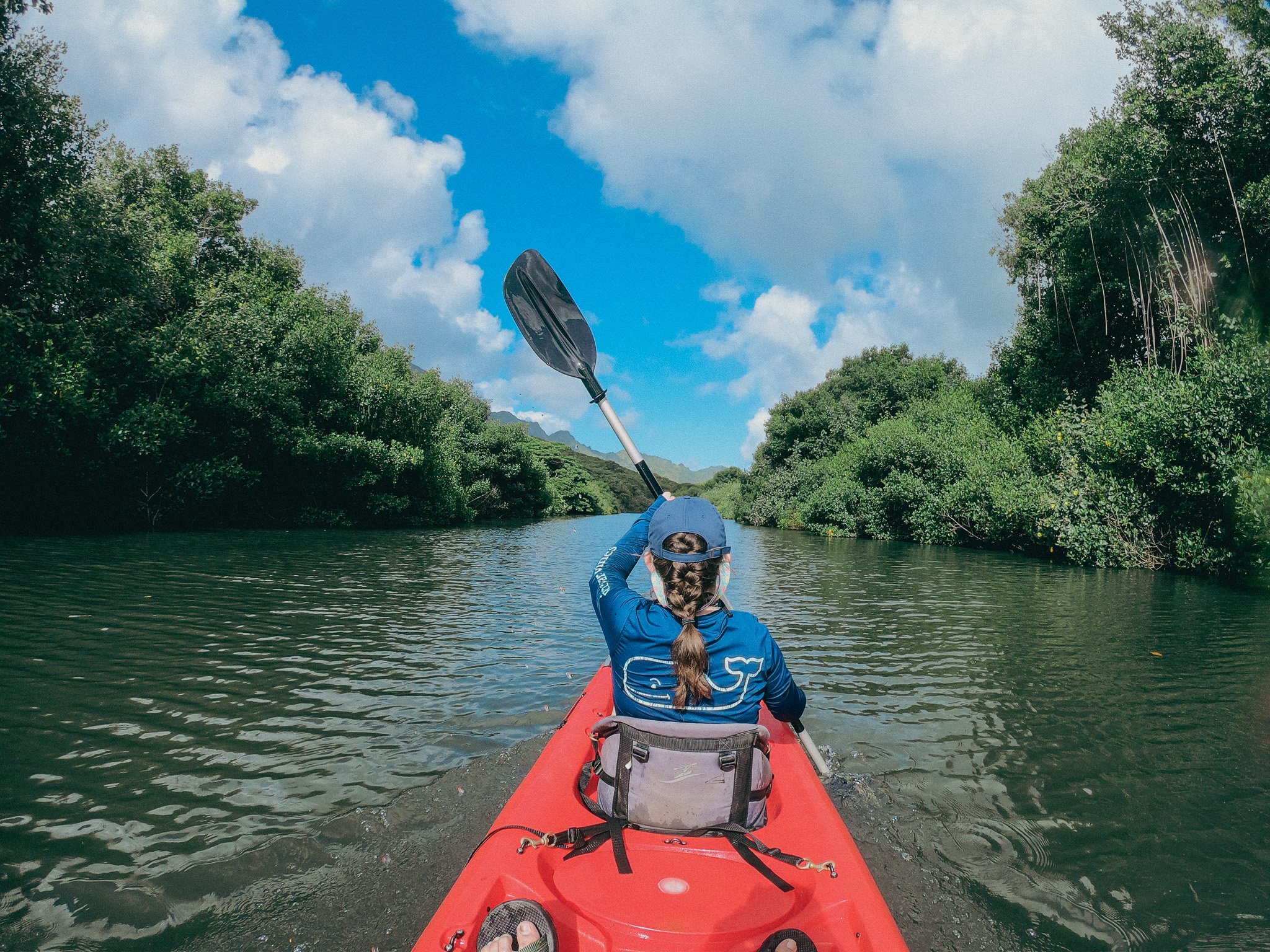 author kayaking up a river in Kauai Hawaii