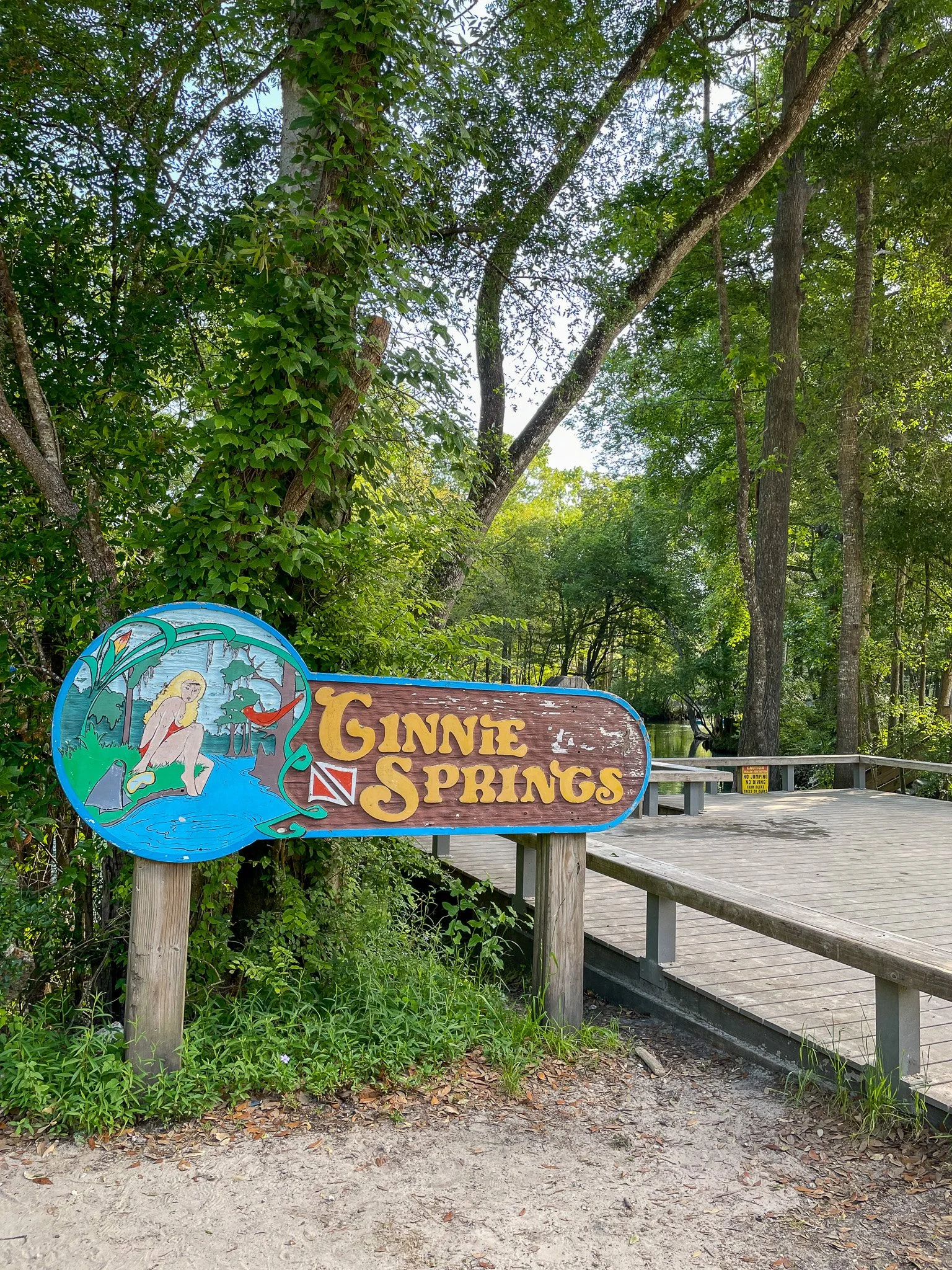 Ginnie Springs sign with a mermaid