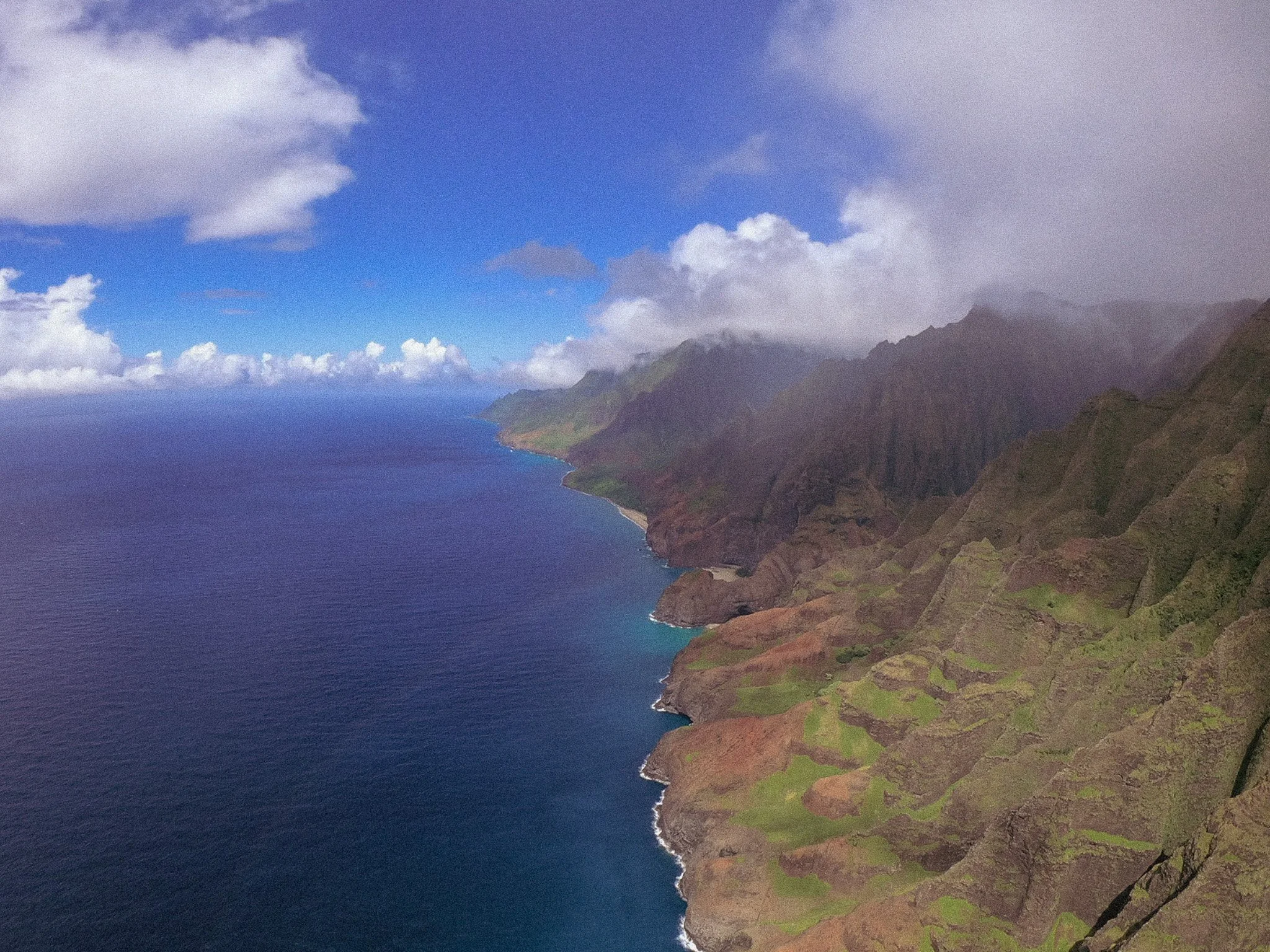 view of napali coast line on kauai, from a helicopter