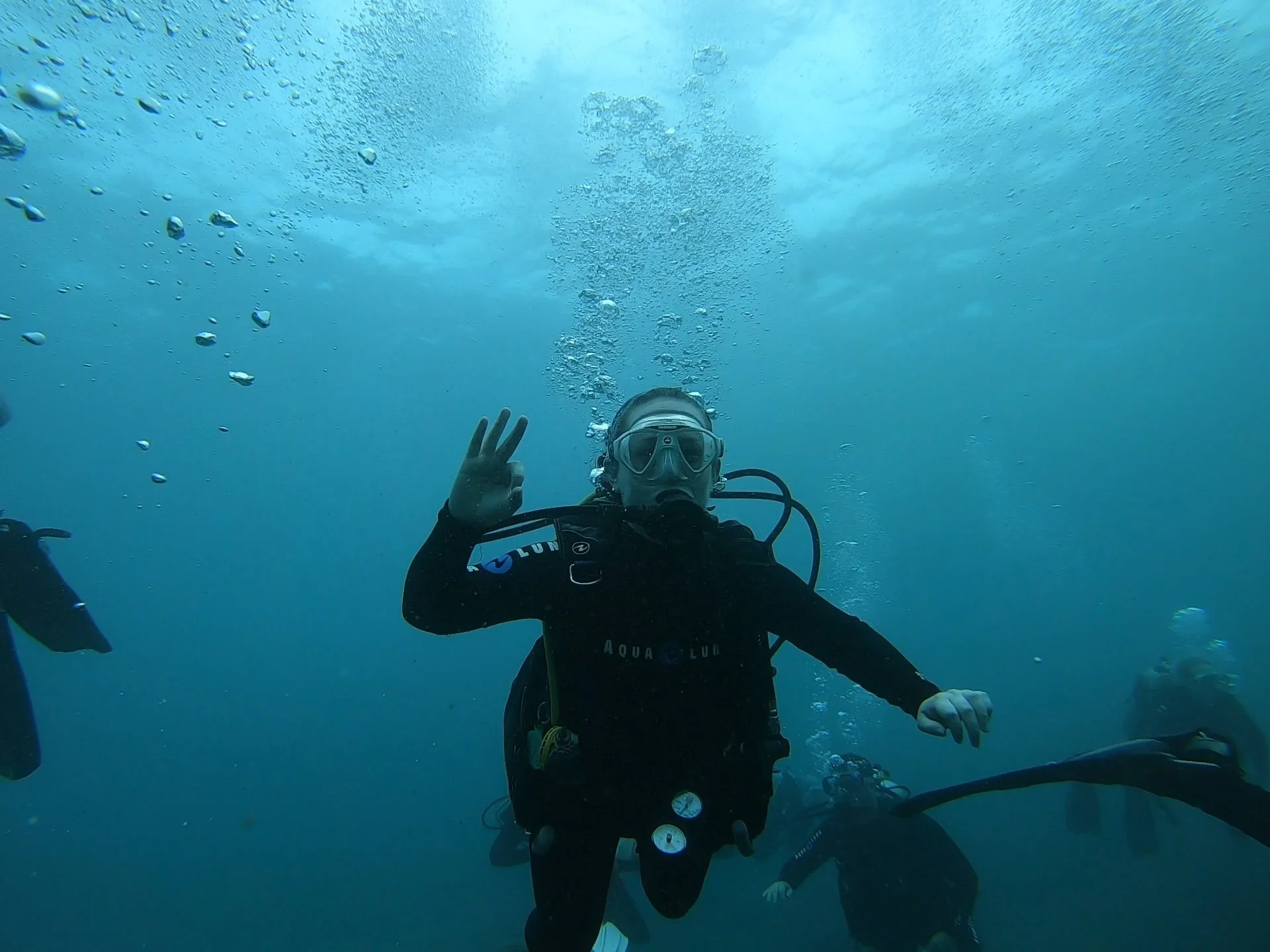 author giving ok signal while scuba diving at koloa landing kauai