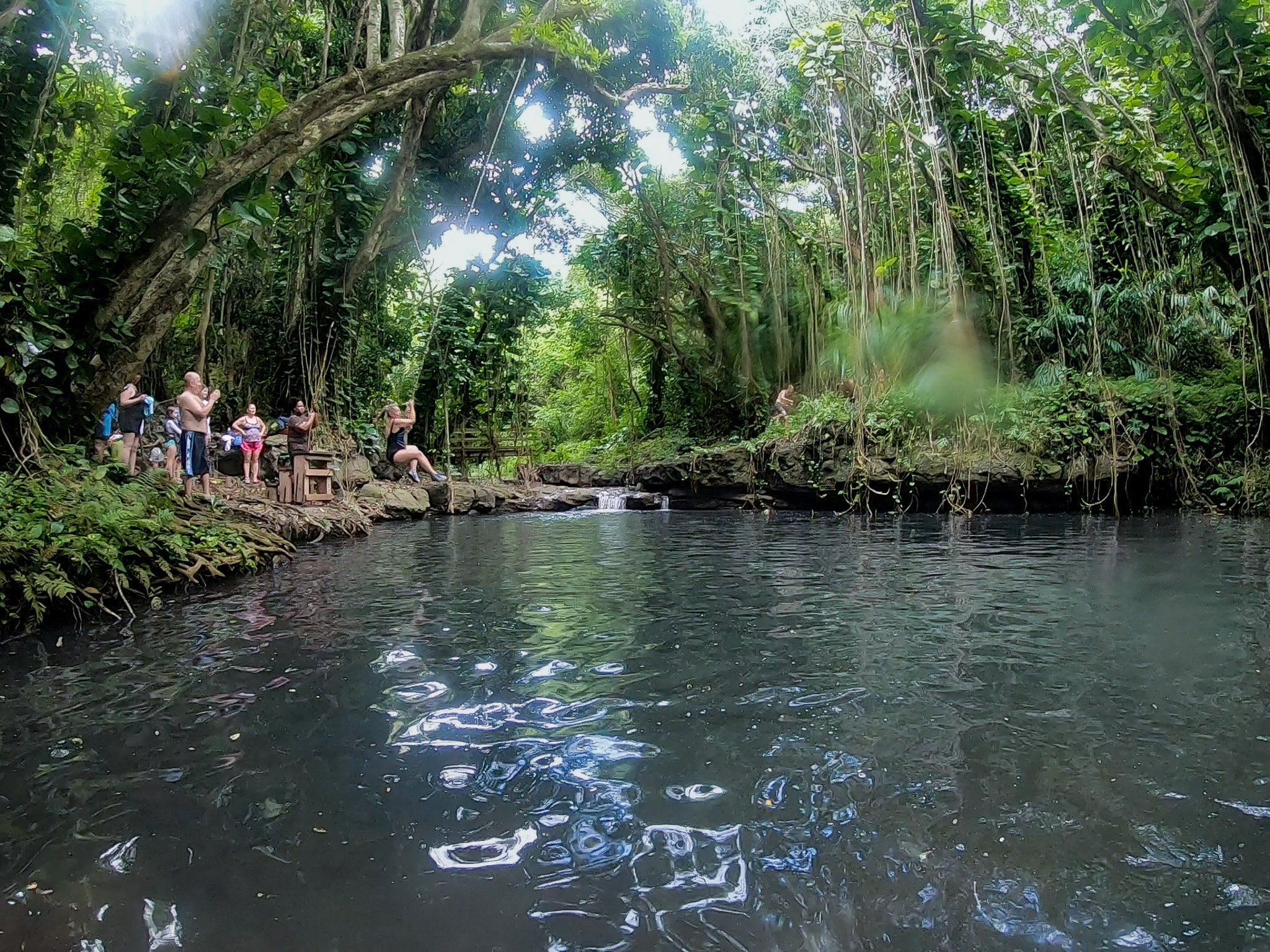 guest on rope swing at Pirate Hole during outfitter kauai kipu safari
