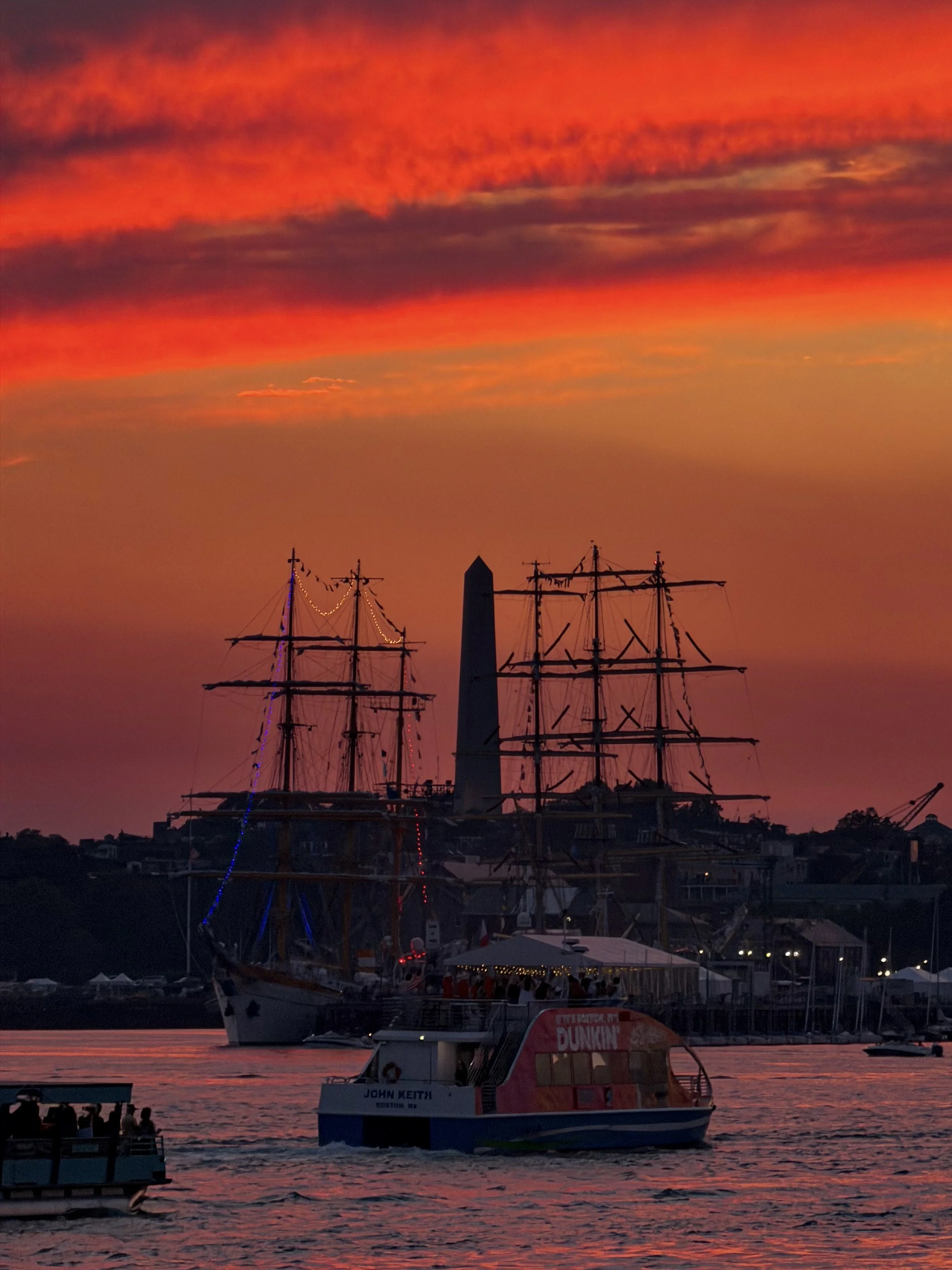 Sunset over Charlestown on 7/15/26 from the East Boston dock. I love being able to commute to and from work via ferry during this time of year! -Alexandria L.