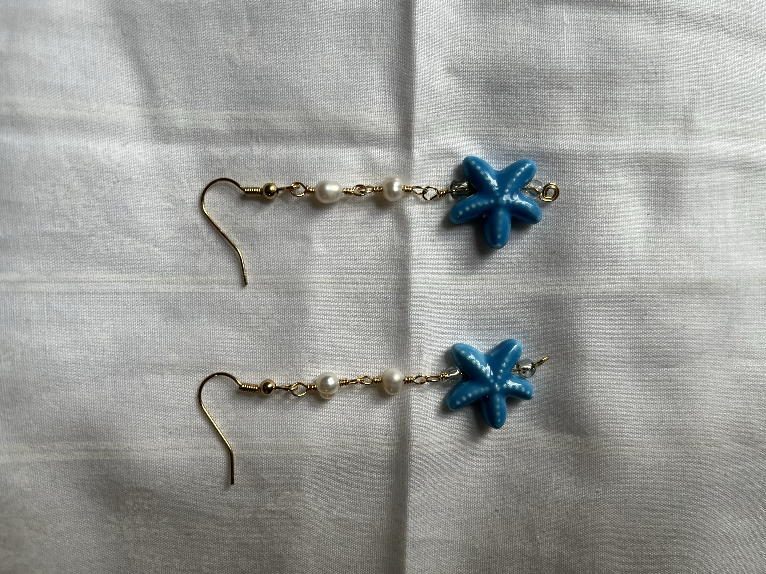 PEARLANDSTARFISHEARRINGS(1).png