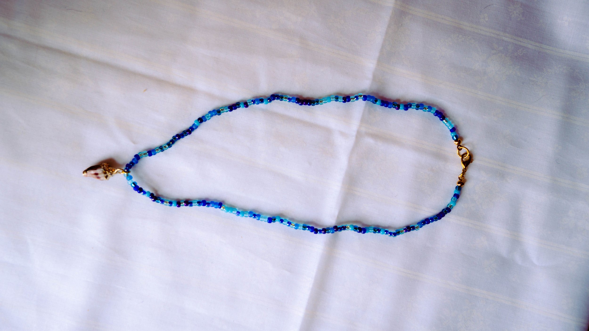 BLUEBEADEDSHELLNECKLACE.jpg