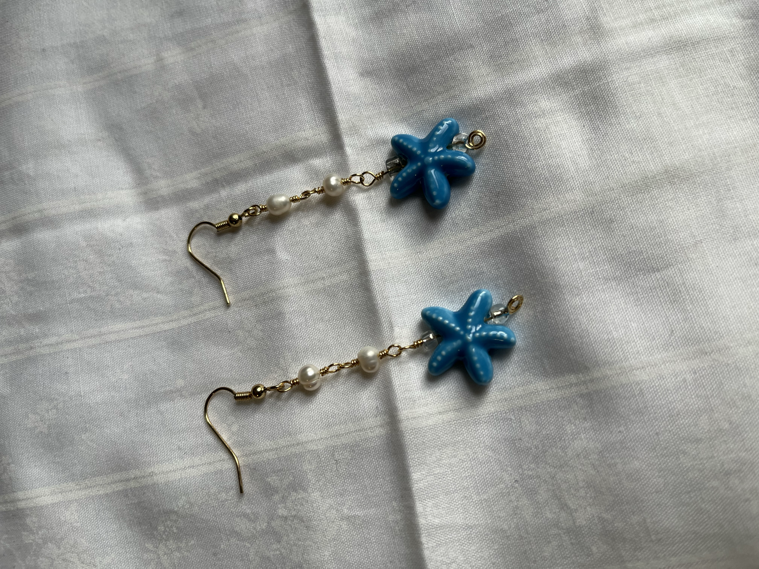 PEARLANDSTARFISHEARRINGS.png