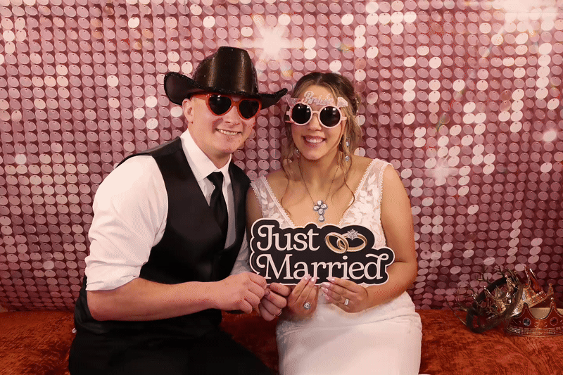From above hands of unrecognizable woman rubbing aromatic spices into piece of raw meat over parchment paper