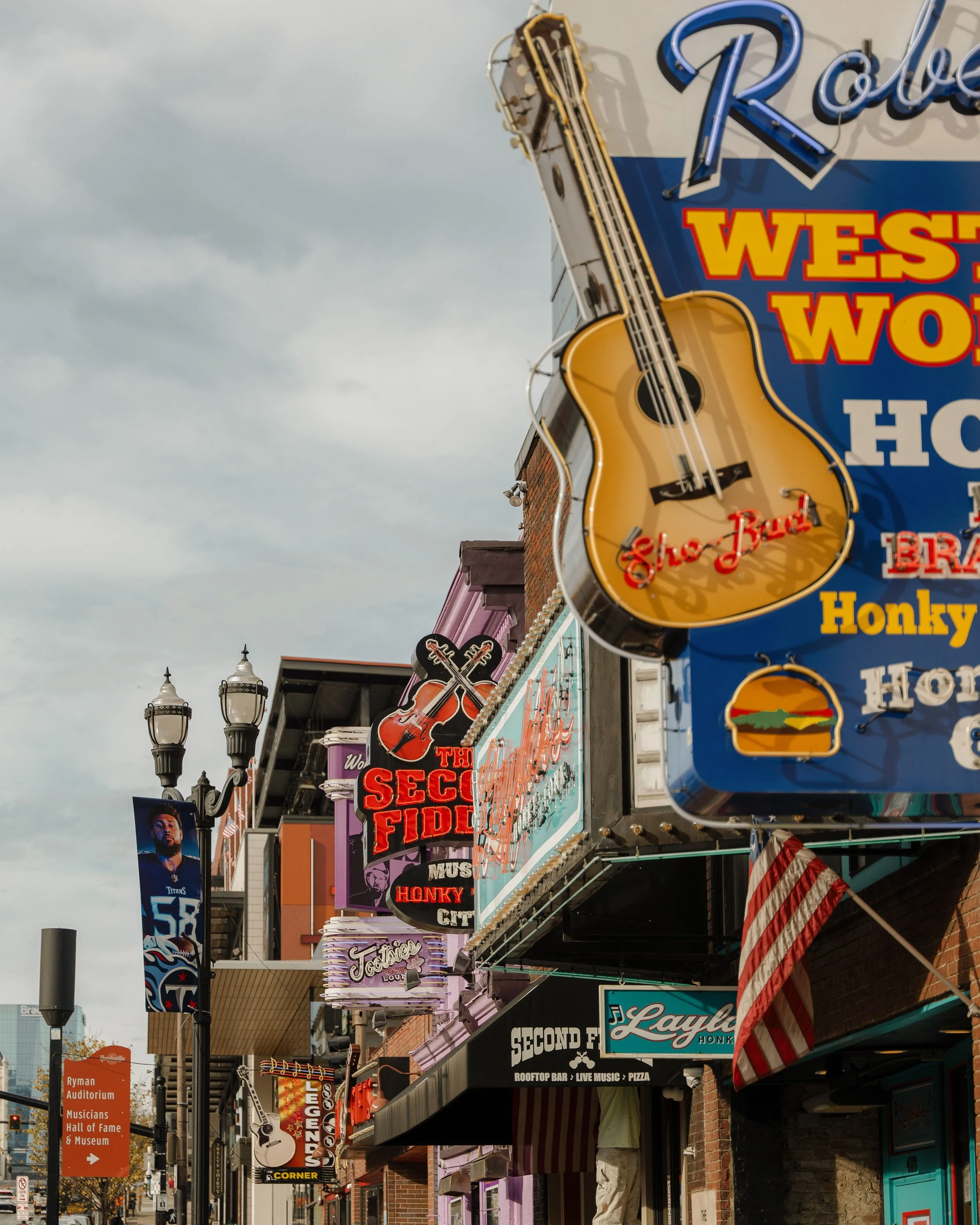 A Nashville street with colorful neon signs